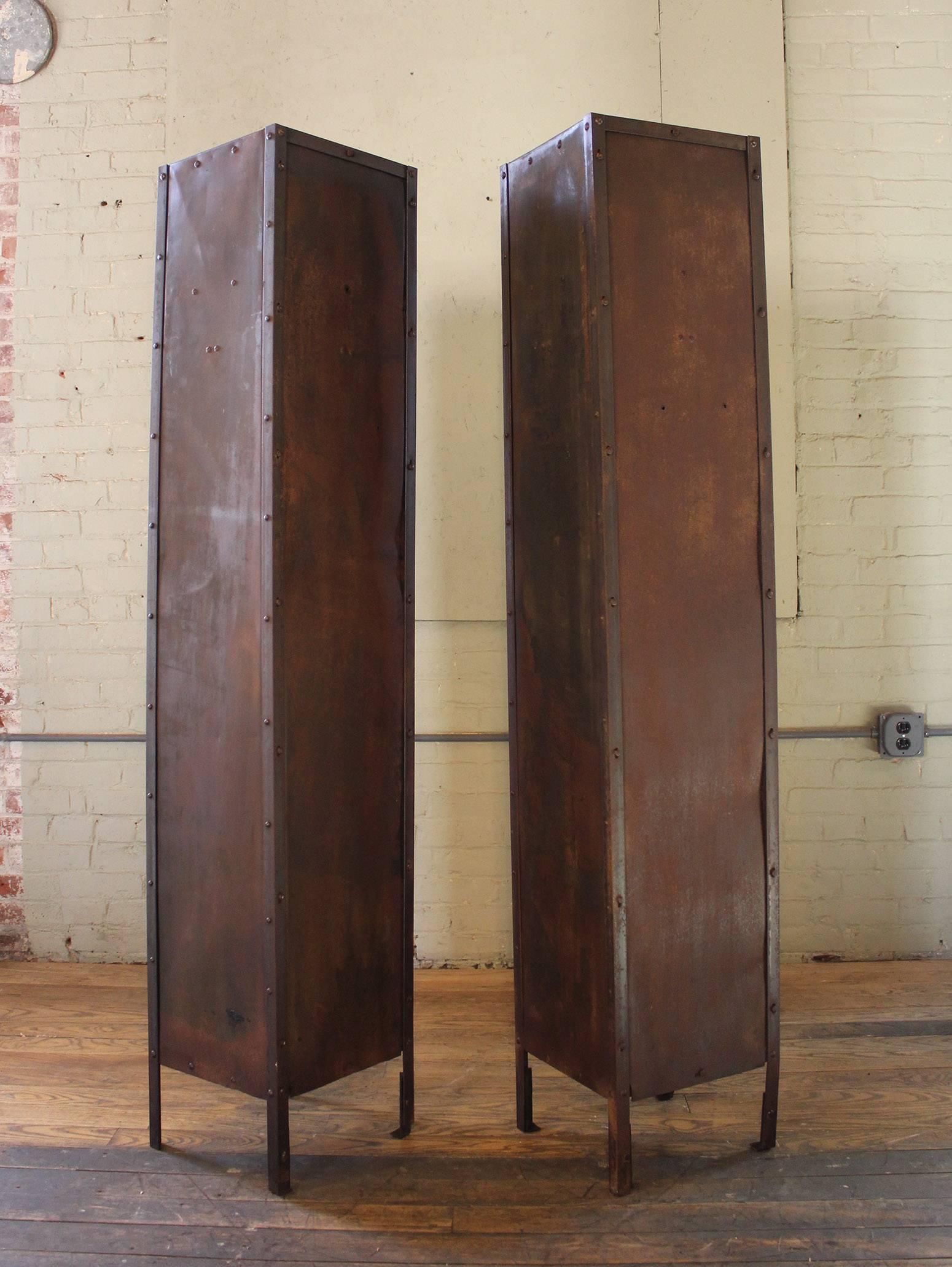 Pair of Vintage Industrial steel Gym storage lockers with coat hooks and shelves. Overall dimensions are 66