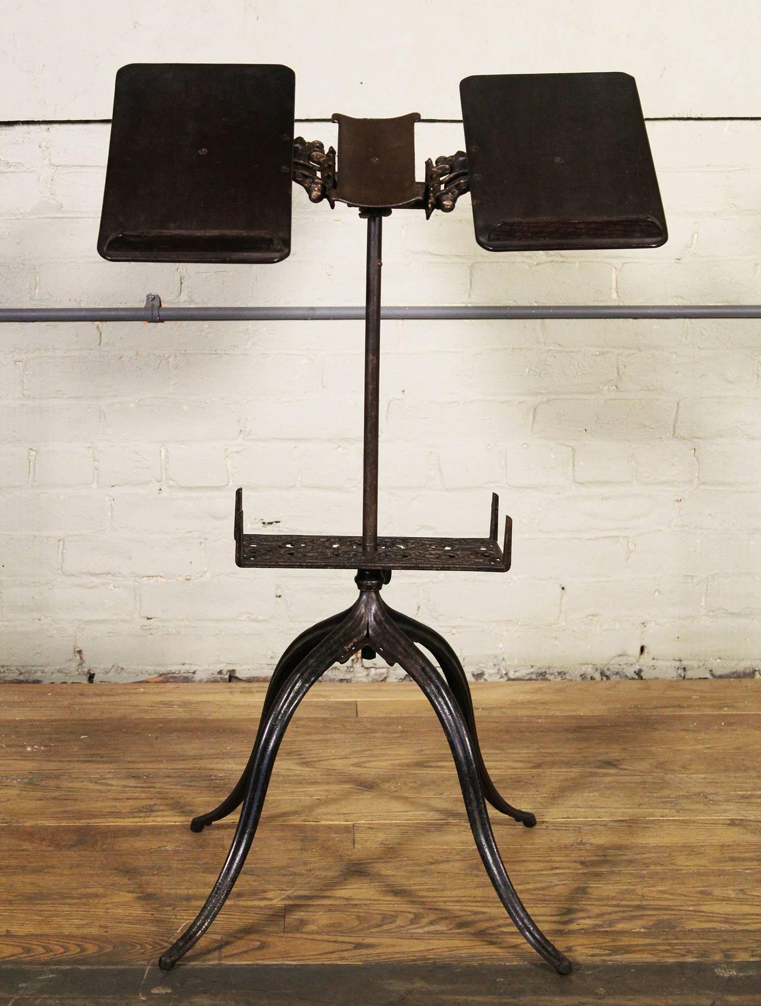 Vintage antique ornate cast iron adjustable bible, dictionary, book stand, table. Early 1900s. The top supports can be adjusted to various angles, and they can be snapped closed to securely hold a book, etc. Measures: Height is adjustable from