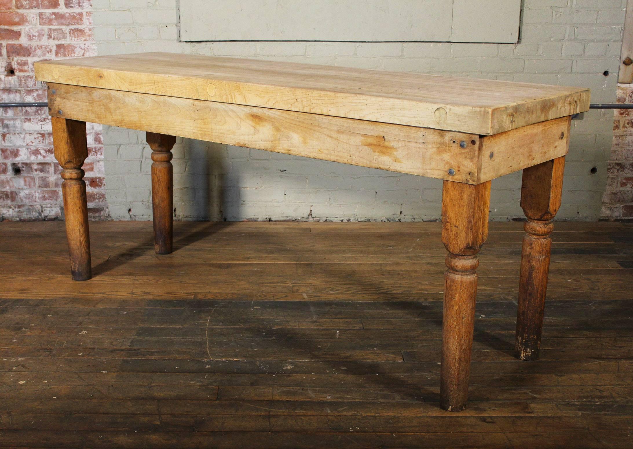 Vintage wood turned leg large butcher block table. Overall Dimensions: 72 1/8