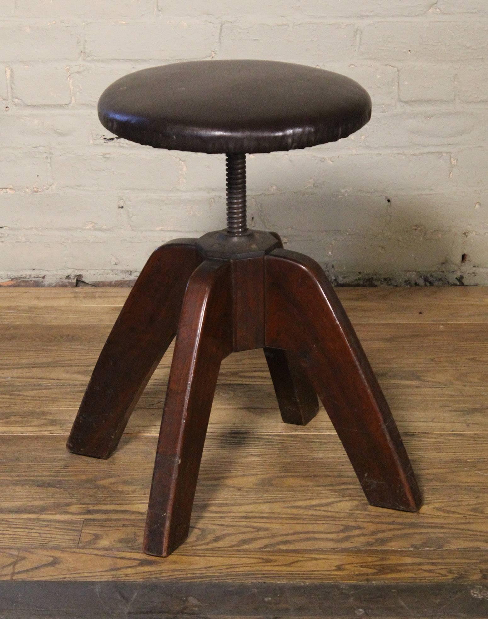 Mid-Century Modern medical, doctor's wood and steel backless adjustable stool by Hamilton. Prouve style legs measure 14 3/4