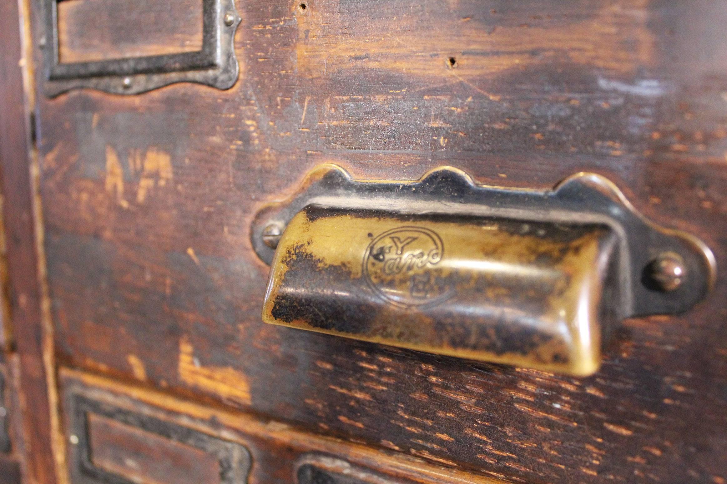 Rolling Apothecary Wood Storage Cabinet, Vintage Industrial with Brass Hardware In Distressed Condition In Oakville, CT