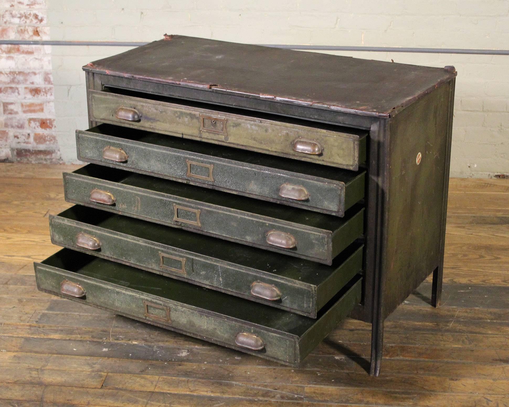Vintage Industrial distressed metal five-drawer lateral flat file storage cabinet or table with worn leather top and copper hardware. Top measures 41