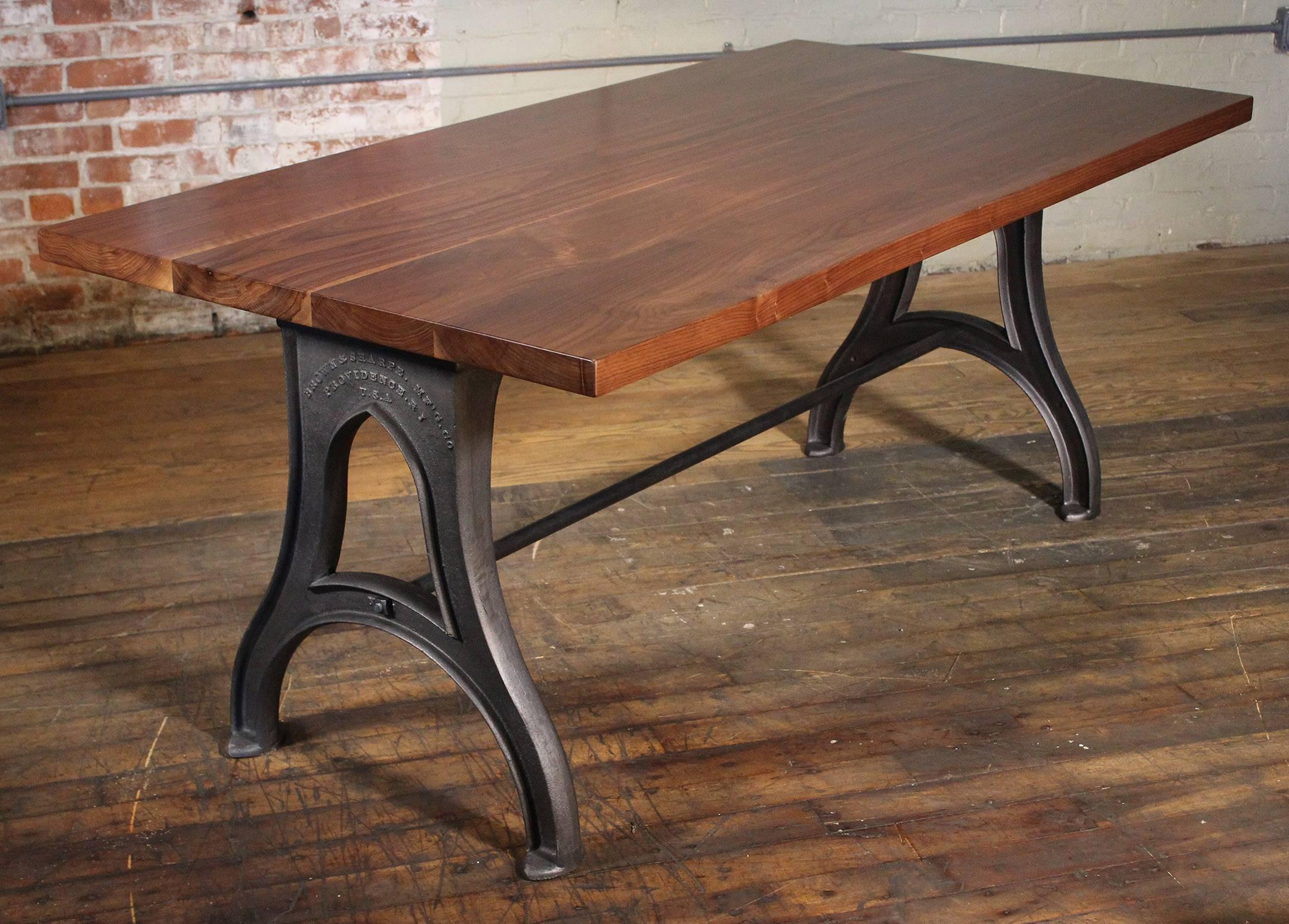 Bespoke Industrial modern work / office bespoke desk / table with 1 3/4" wooden walnut top, "Brown & Sharpe" Cast iron legs and steel stretcher. Overall dimensions measure 72" x 36" x 29 3/4", space between legs