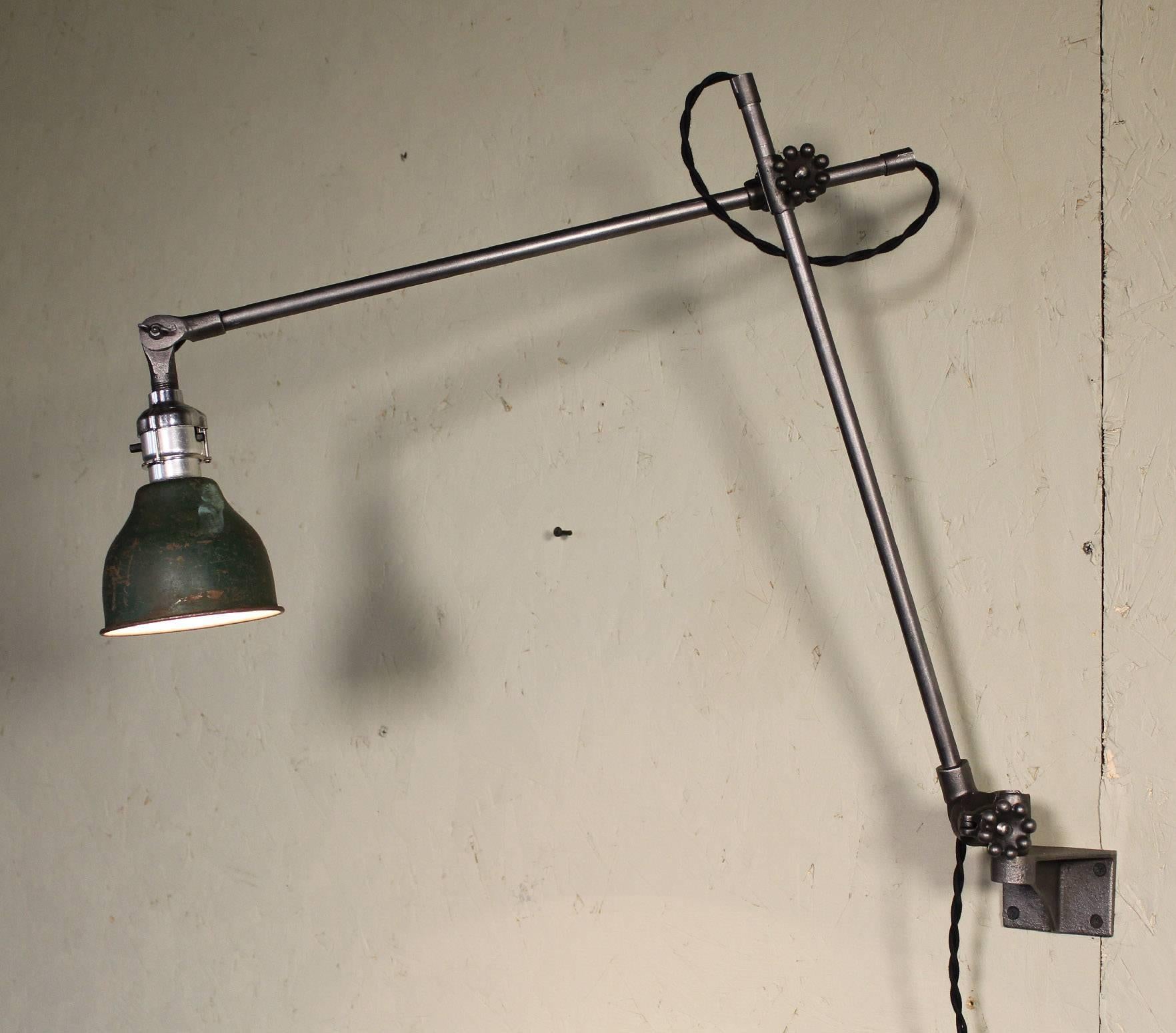 Vintage adjustable steel, metal and cast iron O.C. White wall task light, lamp, sconce. Wall arm measures 18 1/2