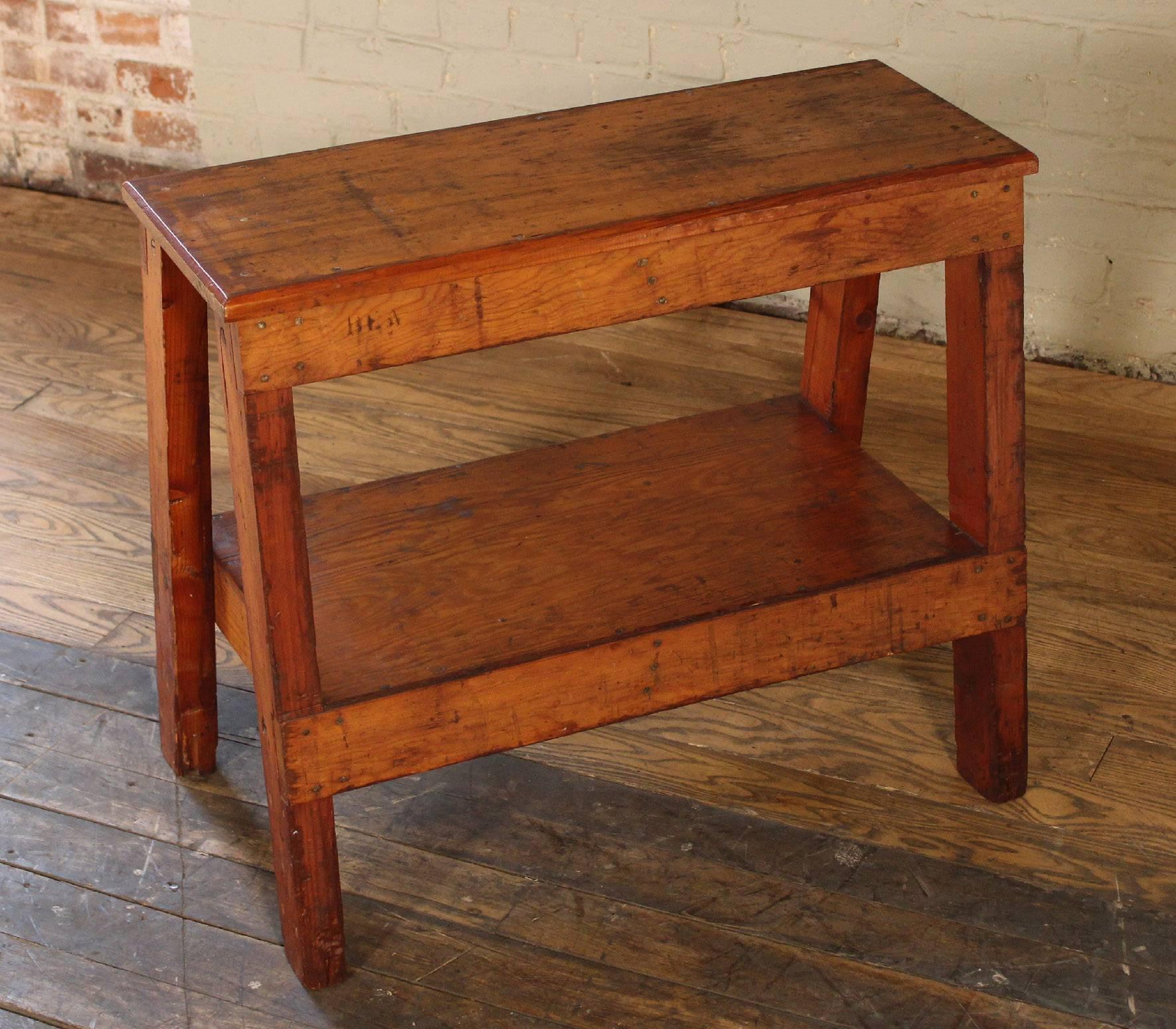 Vintage factory wooden bench, side/end table. Top measures 29" x 11 1/4", overall dimensions are 28" x 16 3/4" x 24 3/8", shelf measures 14 1/4" x 24 7/8" x 10 1/2" in height.