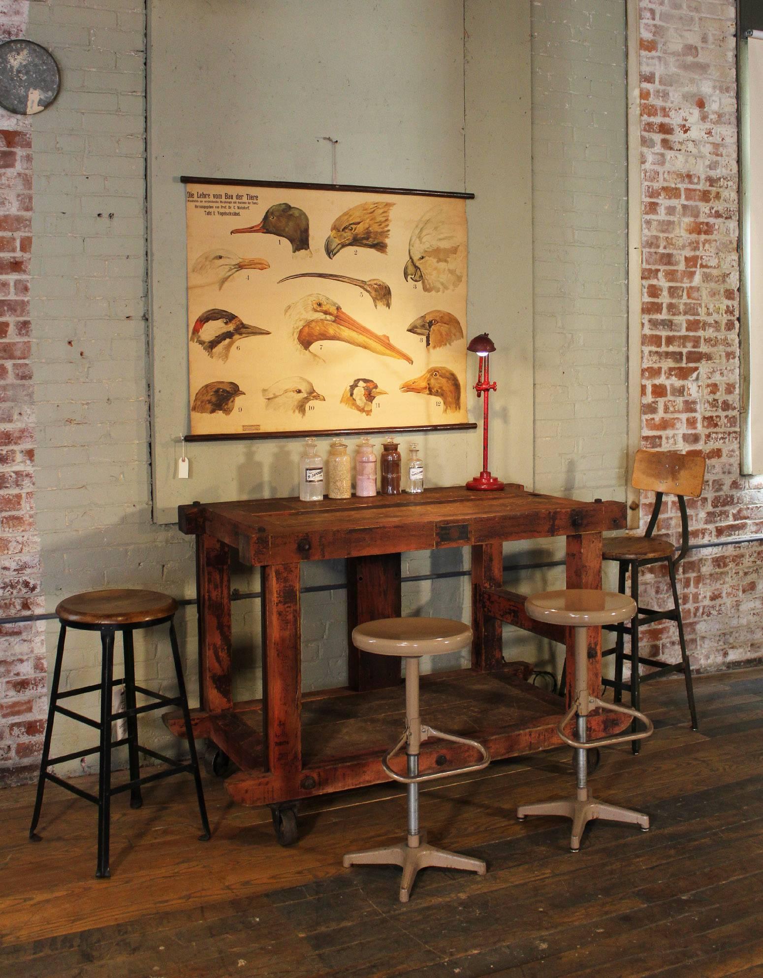 Rustic vintage wood, metal and cast iron rolling kitchen island table or cart. The usable space on top measures 27 3/4