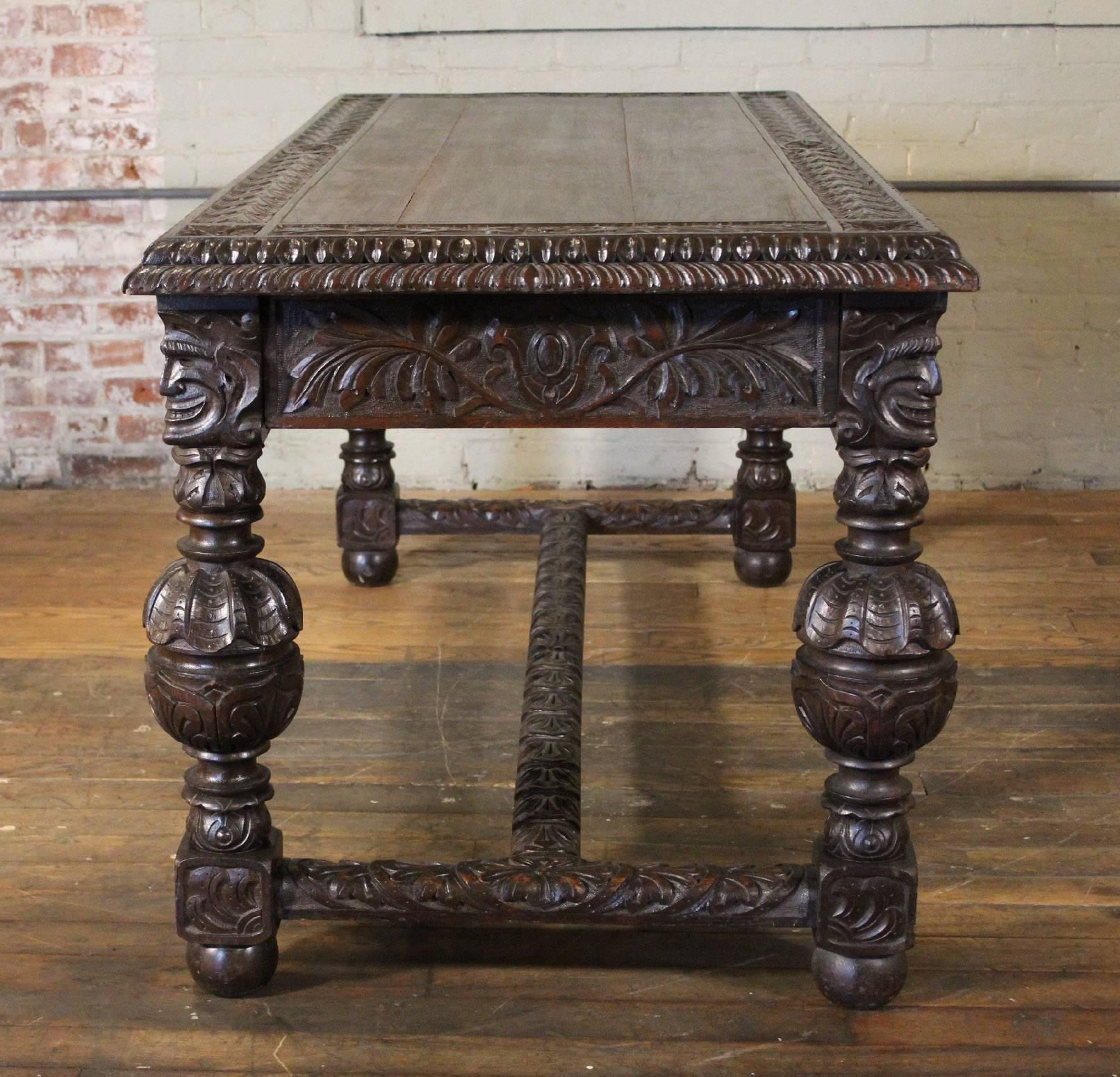 Hand-carved 19th century English oak library table / writing desk with two drawers. Measures 69 1/8