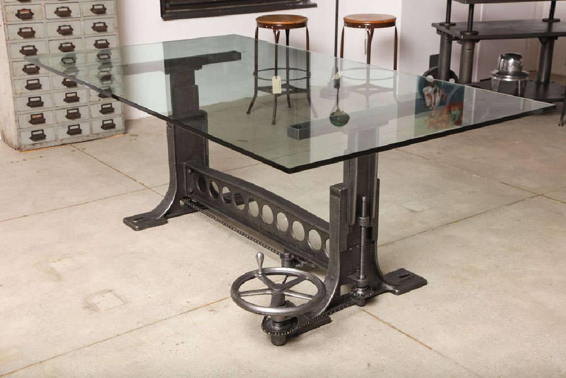 Vintage Industrial adjustable dining table / desk base with floor style adjustments. Rescued from a pre-world war ii factory, this chain driven adjustable table has been fully restored. The wheel engages a chain mechanism which can adjust the height