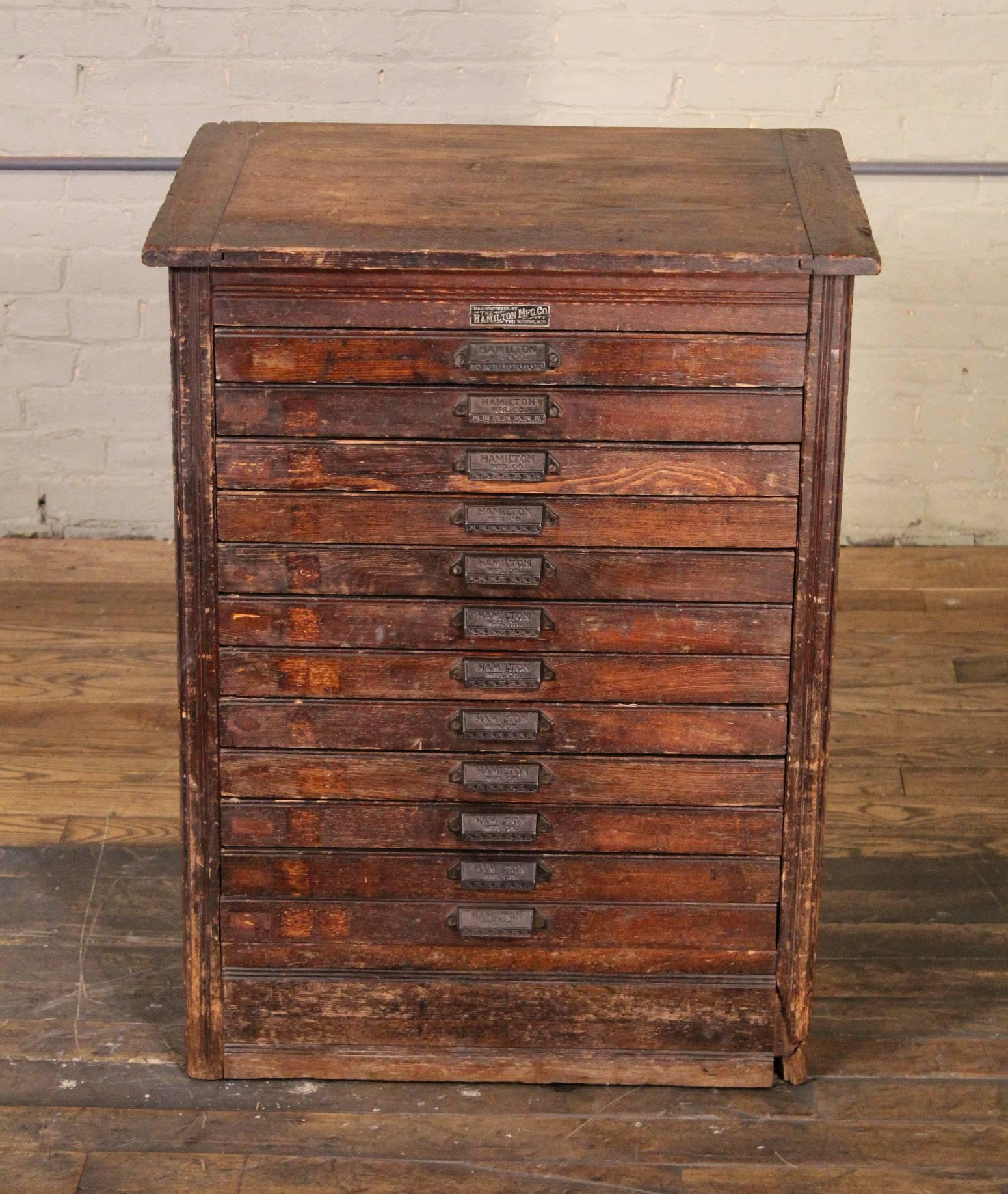 Antique wood flat file cabinet made by Hamilton. Measure: 26 3/4