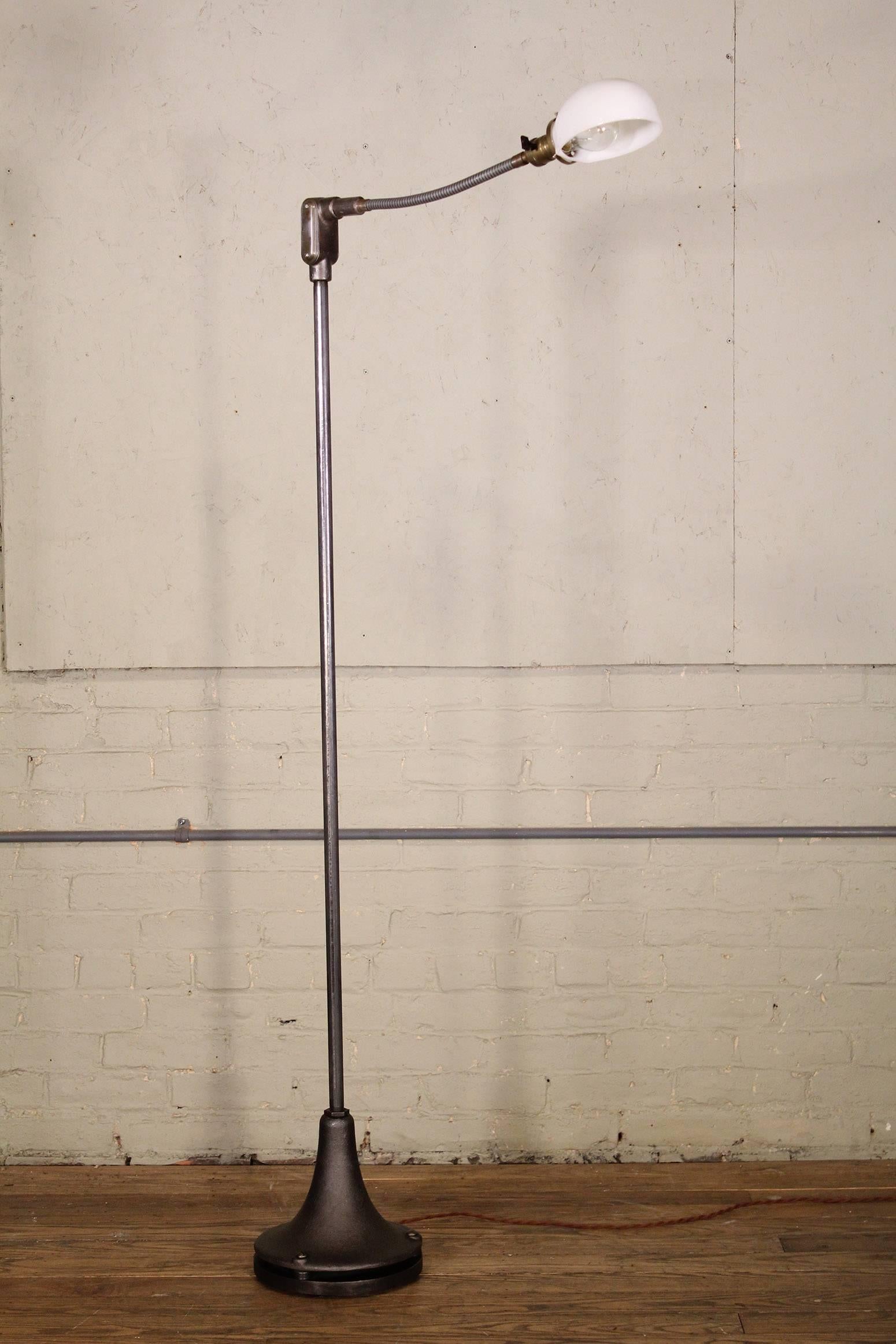 The original floor lamp featured in the rooms of The Gramercy Park Hotel. Cast-iron trumpet base, steel pole, goose-neck arm, brass socket and vintage milk glass shade. Metal shade also available. 
Mreasures
Base diameter 9 1/2