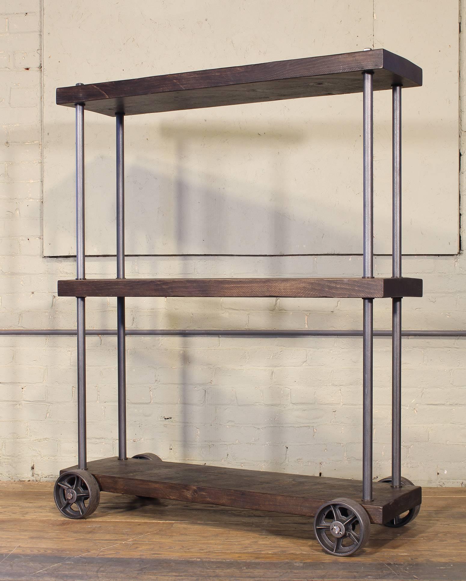 Rough sawn pine and cast iron industrial rolling shelving storage rack unit. Overall height of 53