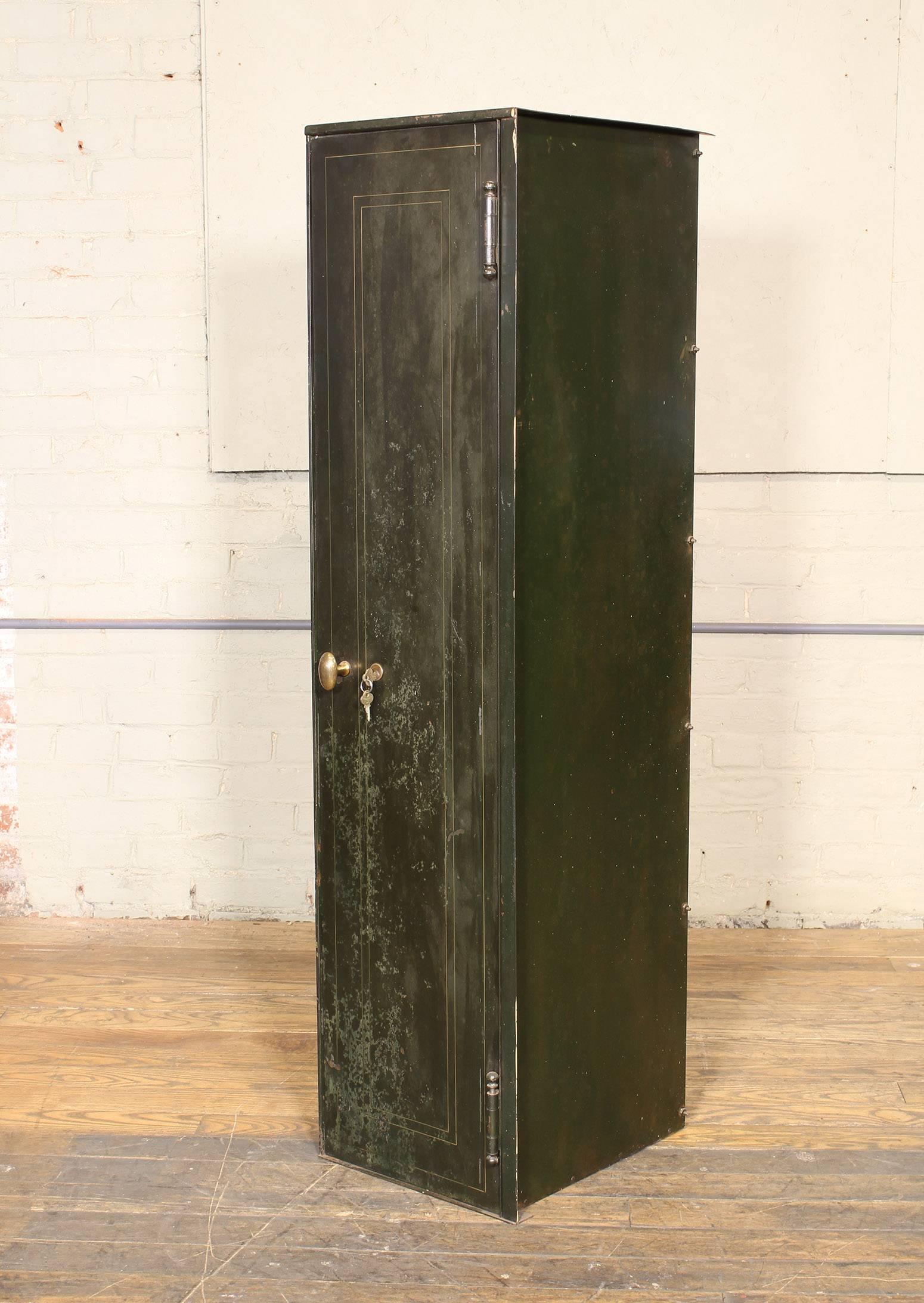 Vintage metal, steel distressed storage locker with lock and key and brass handle. Depth measures 16 1/8