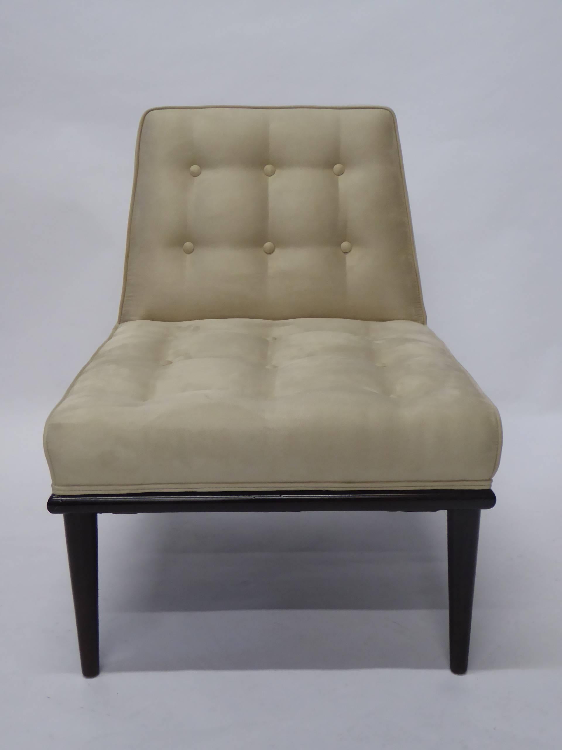 Edward Wormley style lounge or slipper chair with button tufted ultrasuede upholstery. Round molded ebonized wood base with tapering legs. New cream ultrasuede fabric. Quite elegant and urbane.

Measurements:
23 1/2