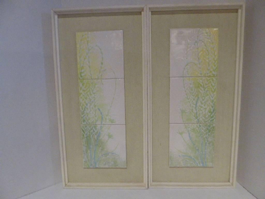 A master at tile art and collage, here are two outstanding framed Harris G. Strong glazed tile murals representing flora teeming with subtle colors of pale turquoise, green, yellow and white on an ivory background great texture and color, in their