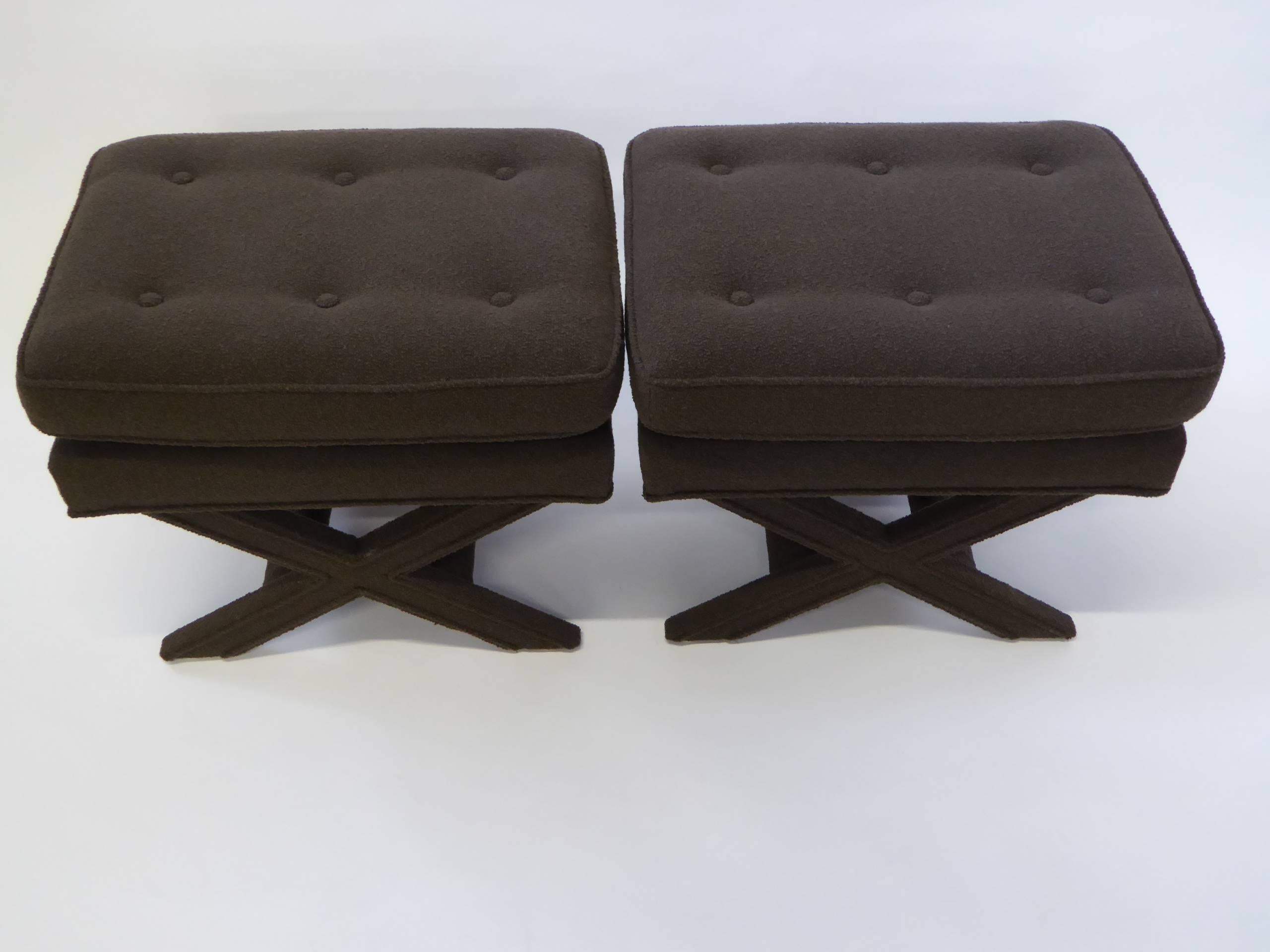 Button tufted and in a warm dark cocoa bouclé fabric, this pair of Billy Baldwin style X-benches are quite urbane and sophisticated. Great welting detail in legs and all around. At the end of the bed, side by side at the cocktail table. Price is for