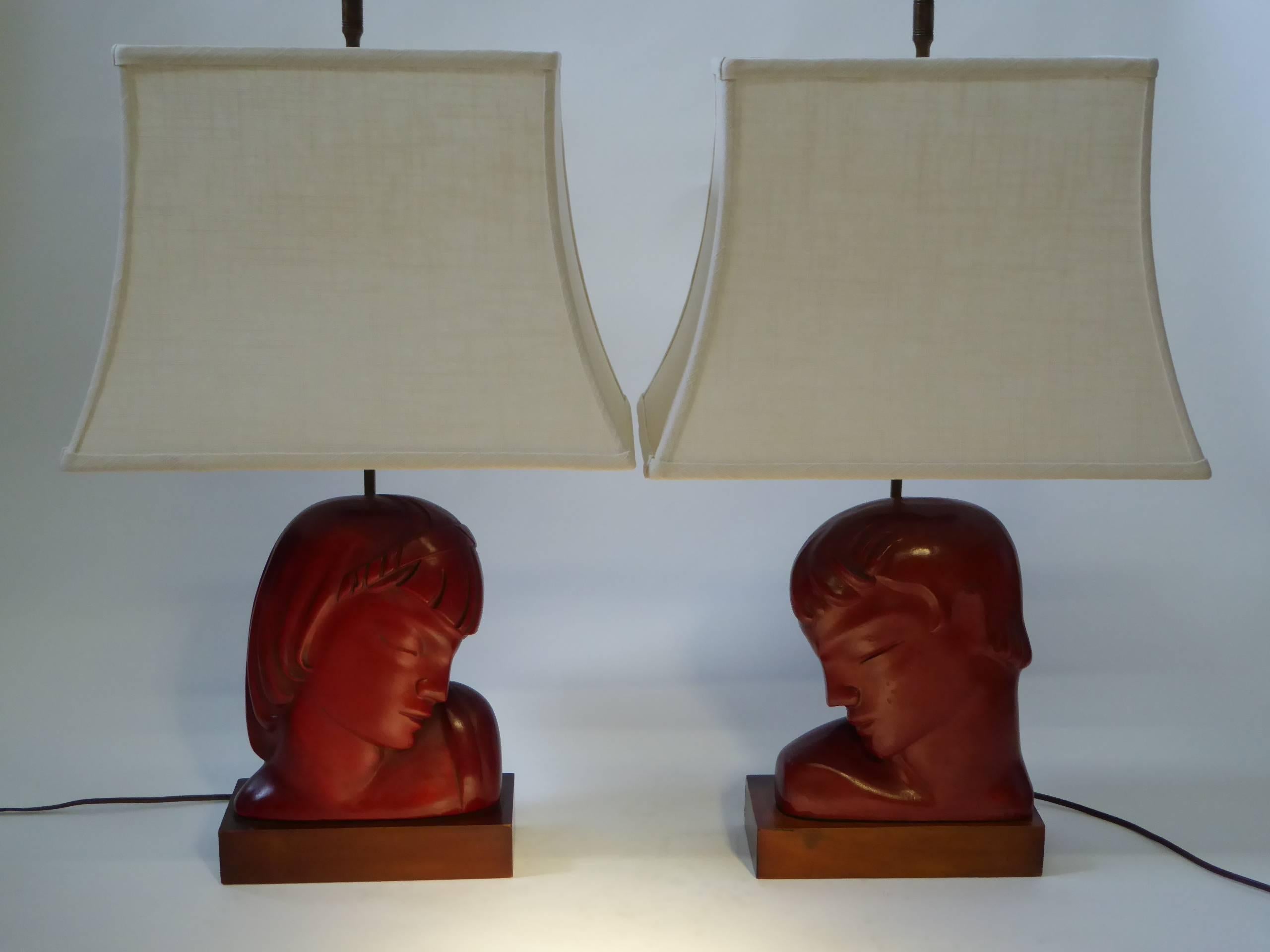 Warm and rich in Cinnabar Red, this pair of Art Deco male and female busts by Frederick Cooper Studios, signed Kupur, are from his early years as an artist sculptor, before he became known mainly for lighting and lamps, Kupur being an artistic