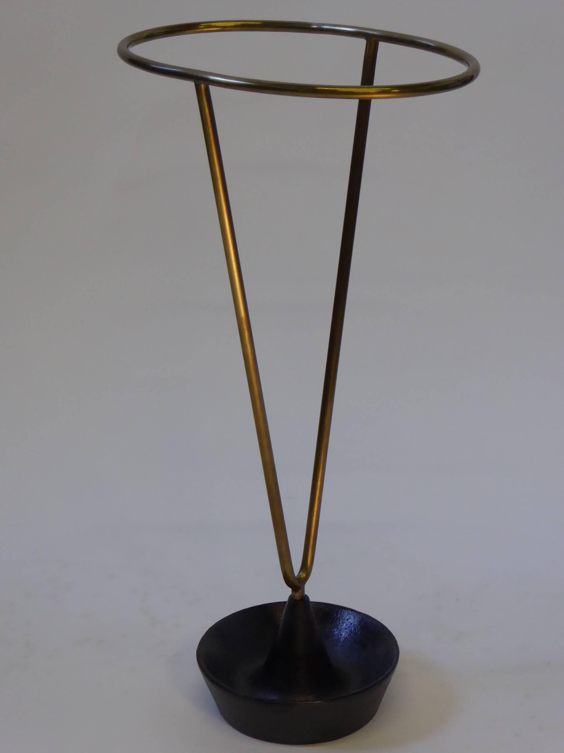 ....SOLD...Early 1950s Carl Auböck brass and iron umbrella stand. Post war styling is evident here with its sculpted iron bowl base and uprising solid brass body. Signed in the brass Aubock and made in Austria. Excellent condition.
Measurements: