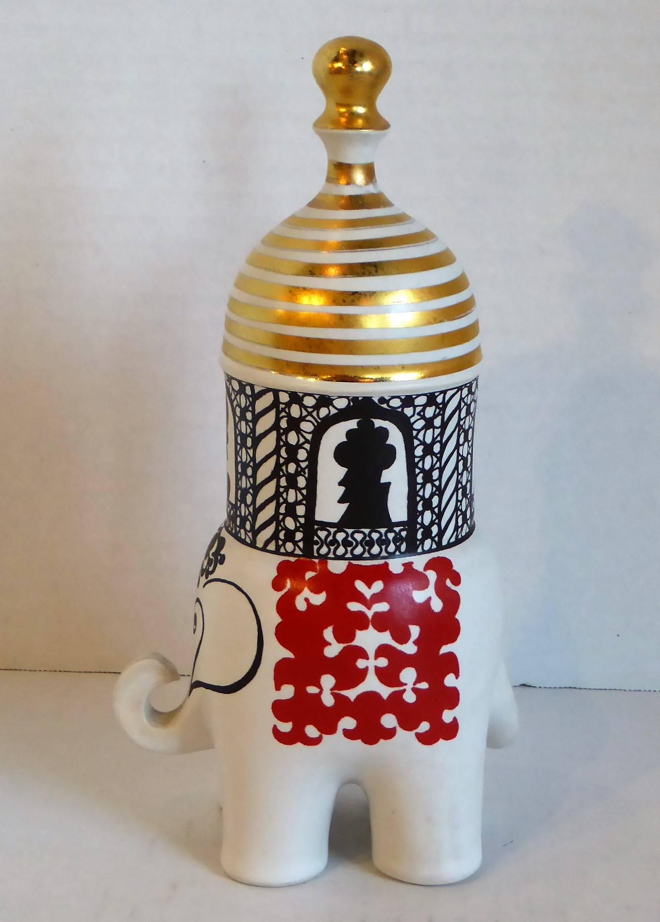From noted Swedish artist Lisa Larson (b. 1931) for Gustavsberg, a rare 46 year old find from her Traffic Series in 1970. Here, the "Elephant" with the Maharajah riding in the domed cabin. Elegant in white stoneware with red and black
