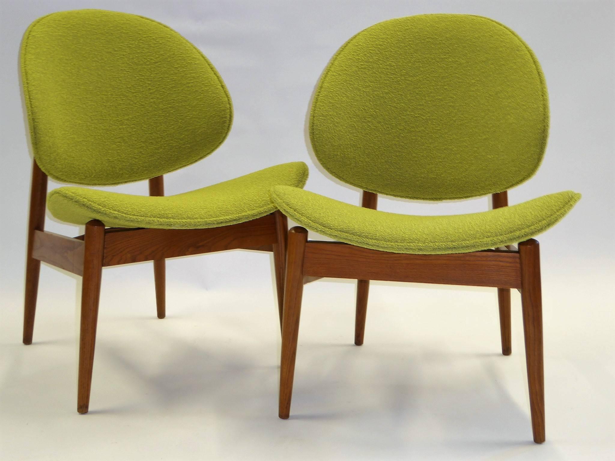 Early 1950s clam shell chairs designed and patented by Seymour James Weiner for his Miami company Kodawood. Beautiful walnut bentwood and lathe turned, they have distinctive shaping. Newly upholstered in a green bouclé weave. Yummy! Last name