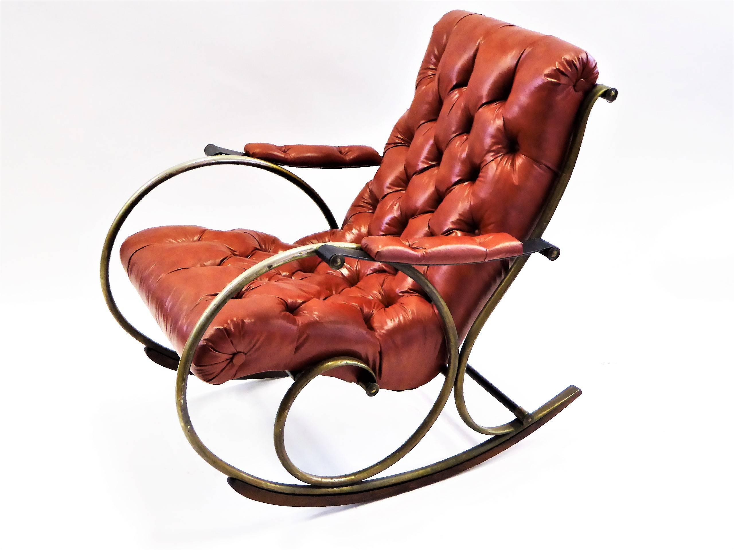 REDUCED FROM $1,500.
With a Mid-Century styling inspired by turn of the century Edwardian tastes, this Lee L. Woodard designed rocking chair is most comfortable and the tufted leatherette upholstery divine. With a antiqued brass finish over nickel