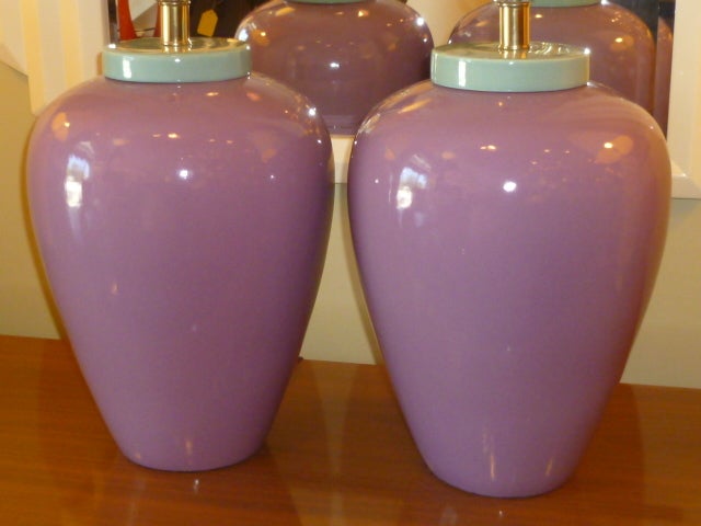 Whether they ring Miami Vice or Memphis to you, this pair of oil jar shaped glazed porcelain table lamps are exciting. The color mix of plum and teal divine! Great bulbous shape with brass neck and sockets. New UL 3 level sockets. Heavenly