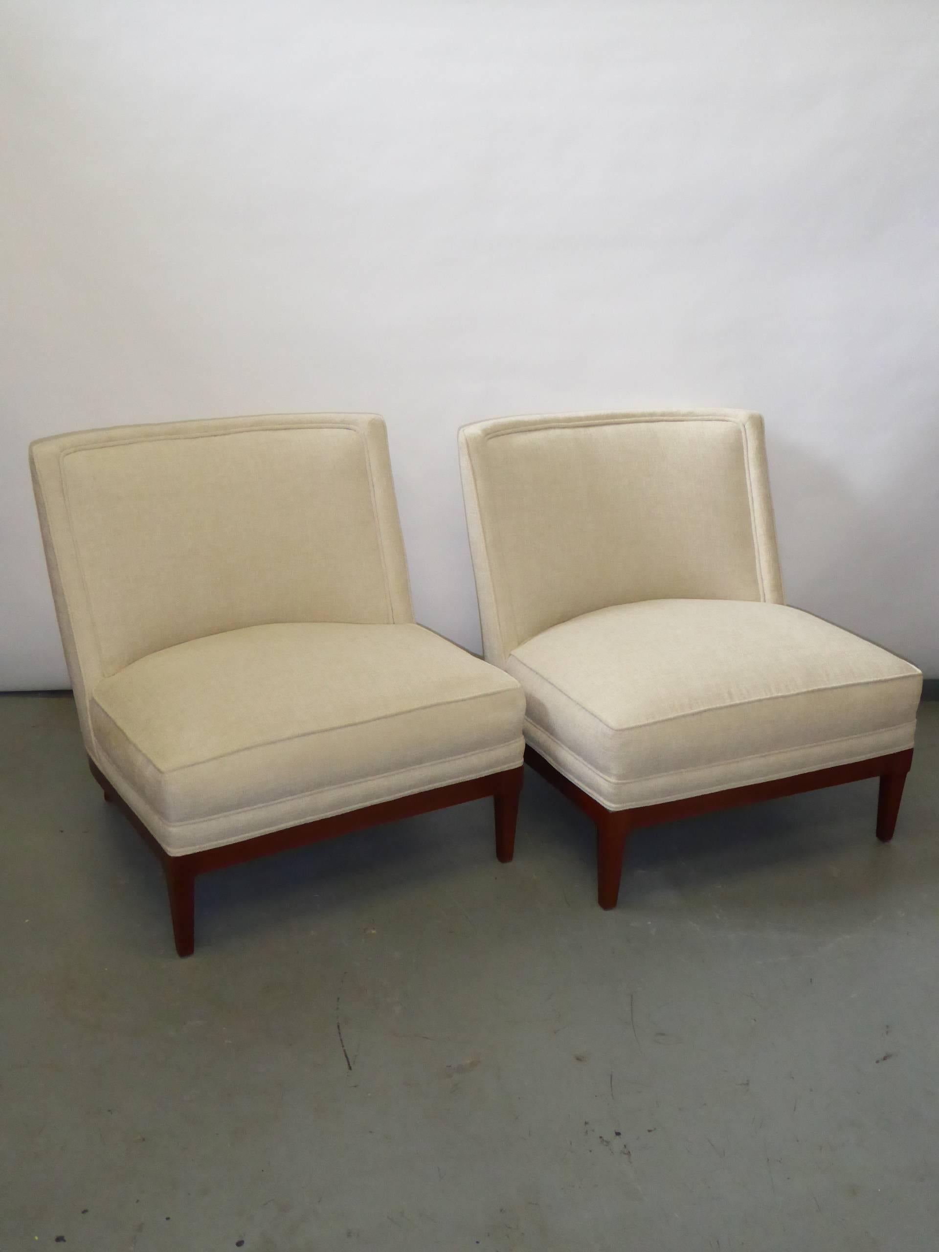 SOLD  Sleek, urbane and sophisticated pair of round back Lounge Chairs or Slipper Chairs in the style of William 