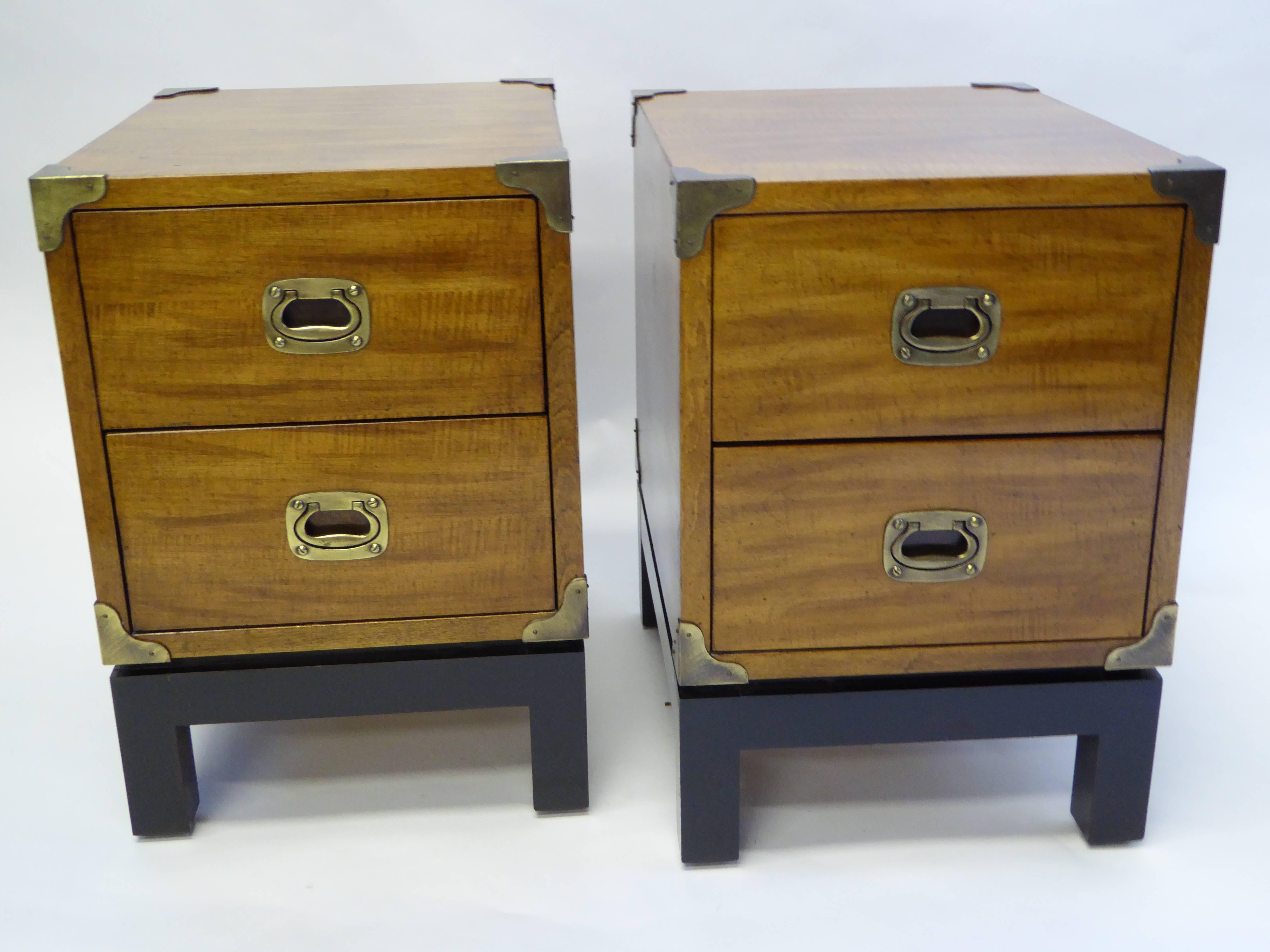 Pair of 1970s brass-mounted walnut bedside tables in Campaign style. Each with two drawers and black parson style bases. Wonderful figured wood and great scale.

Price is for the pair.

Measurements:
14