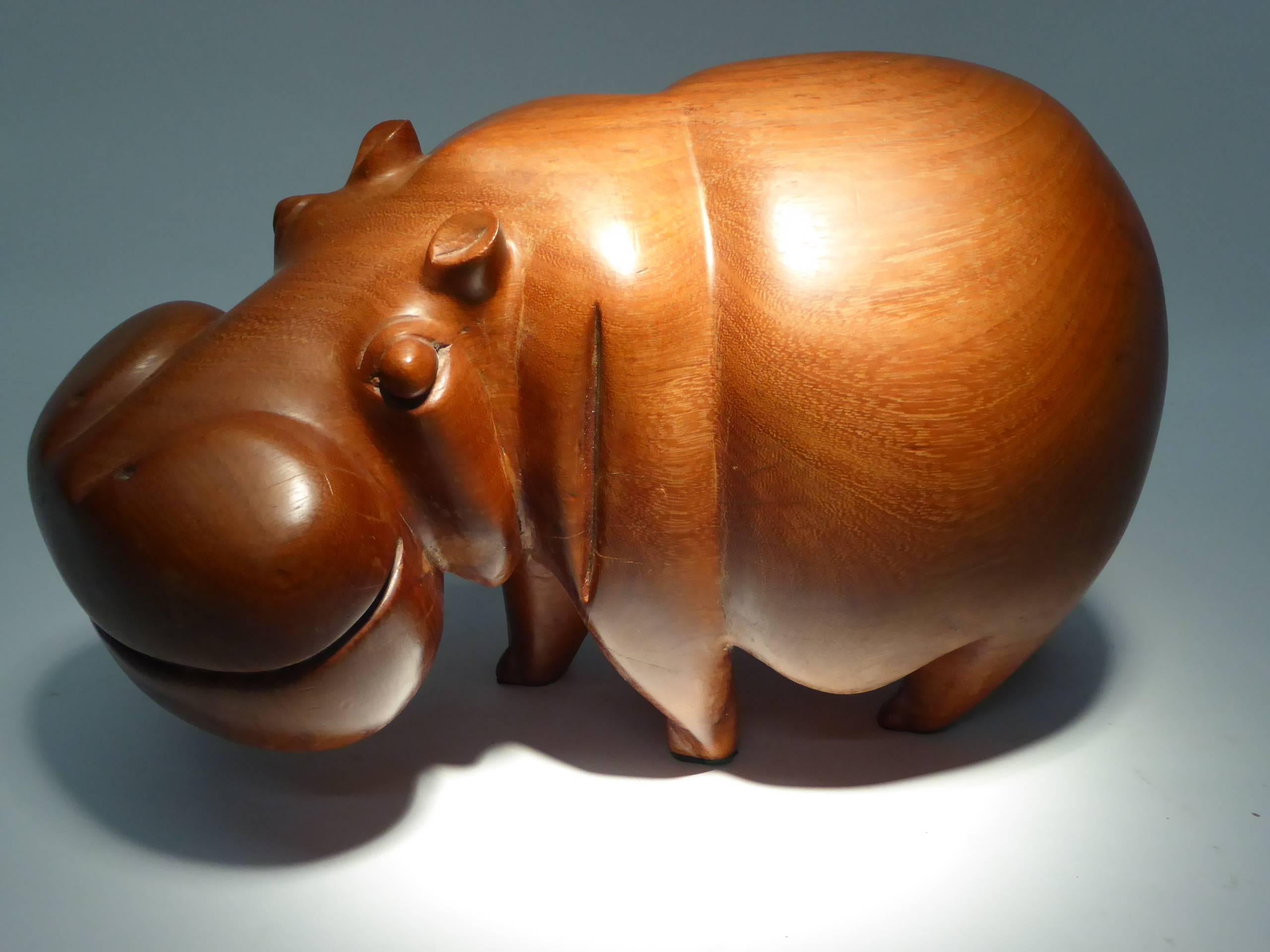 Adorable and appropriately heavy, carved solid teak Hippopotamus.