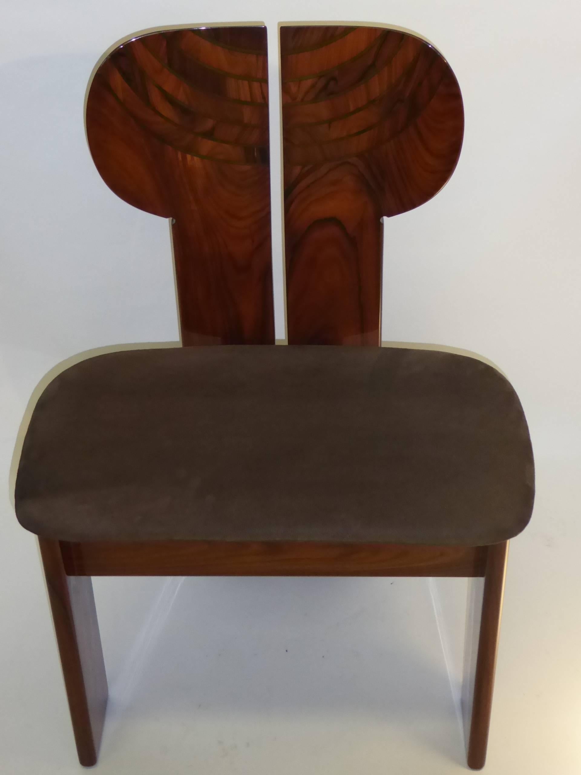 Designed by Afra and Tobia Scarpa, this Africa chair in rosewood or palisander has a suede leather seat.  In excellent condition, it makes a perfect side chair, desk chair, a work of art.

The Africa chair from the  Artona series was designed in