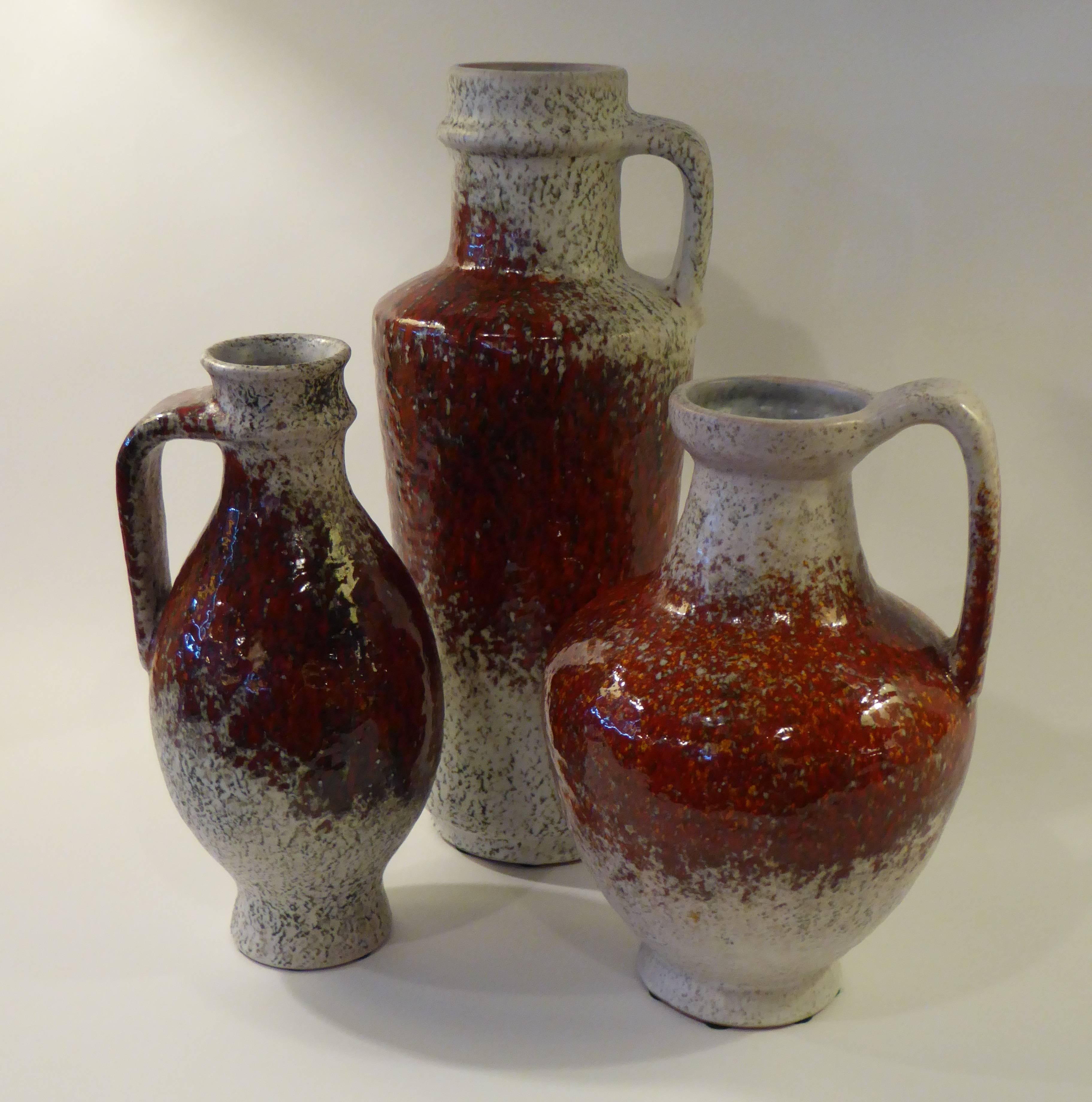 REDUCED FROM $1,250....Magnificent grouping of large krug form pottery vases by noted German potter Friedegart Glatzle for Karlsruhe. Three handled vases with a rich 
