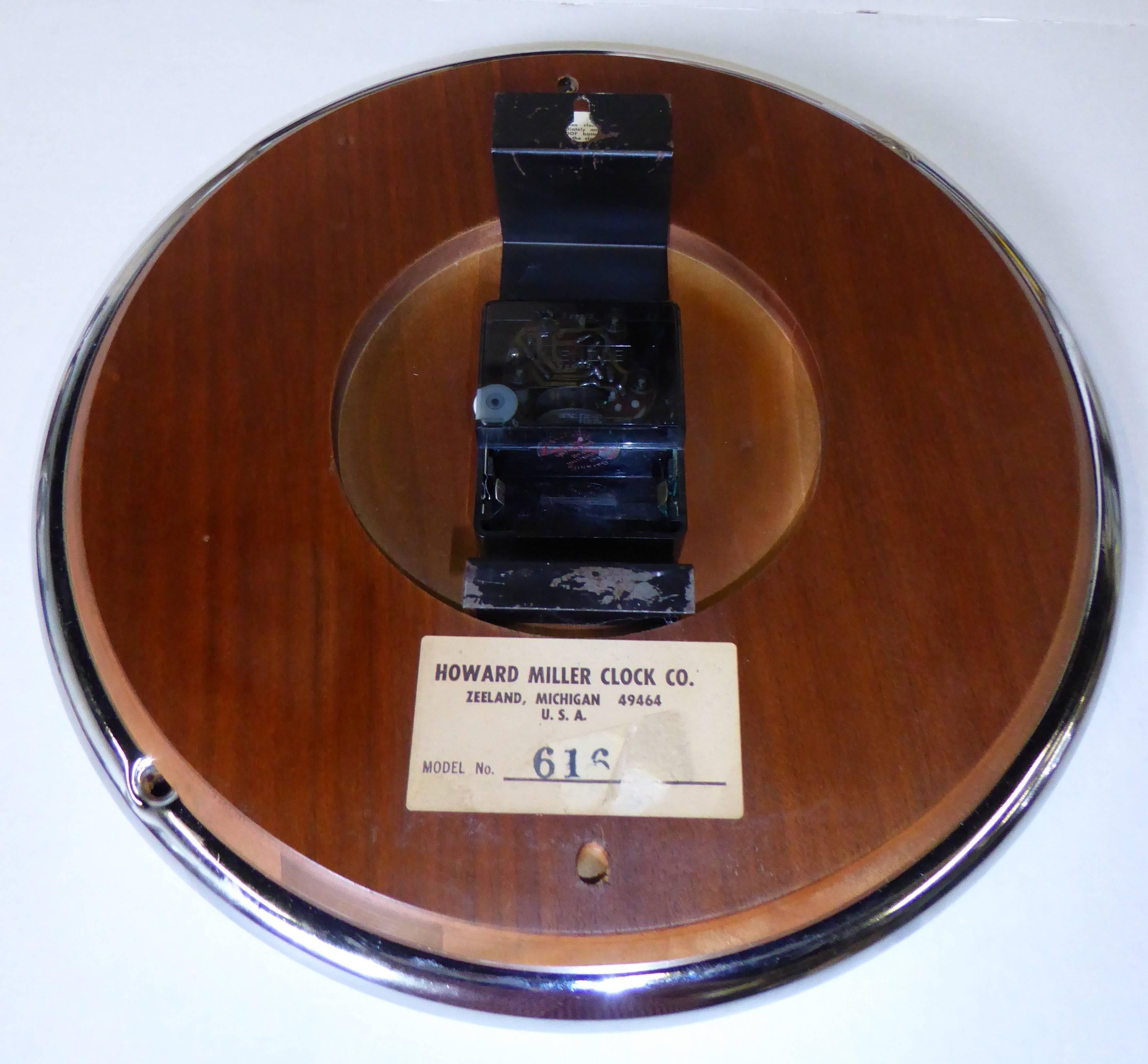 REDUCED FROM $995....Beautiful Howard Miller clock in chrome and African zebrawood with a highly figured grain with George Nelson hands, this clock matches the Peter Protzman desk and credenzas by Herman Miller produced only in 1970-1971. Clock