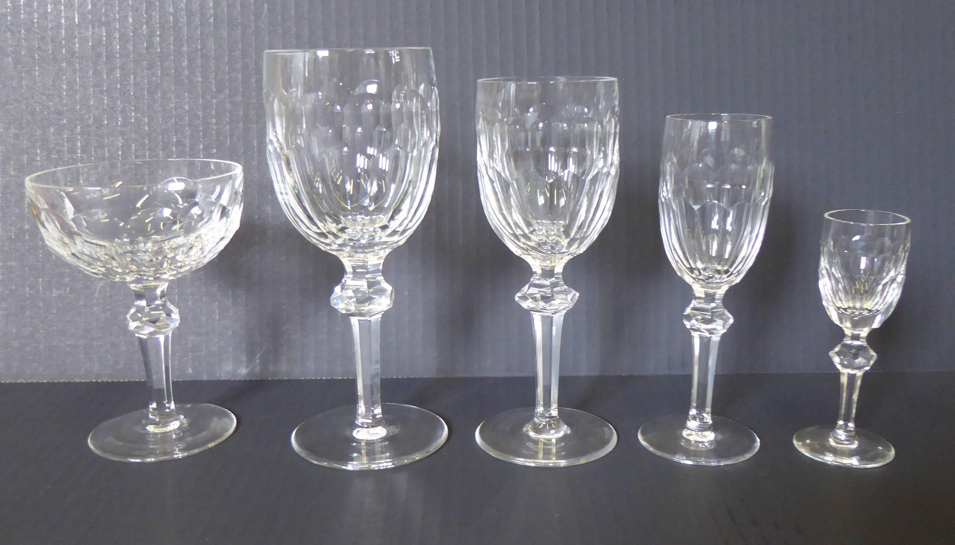 Curraghmore, introduced in 1968, is an elegant sparkle to the table from Waterford. Vintage and mint from 1973, this ensemble of 38 pieces of stemware includes eight each goblets for Champagne, claret (red wine), water and cordials and six sherry