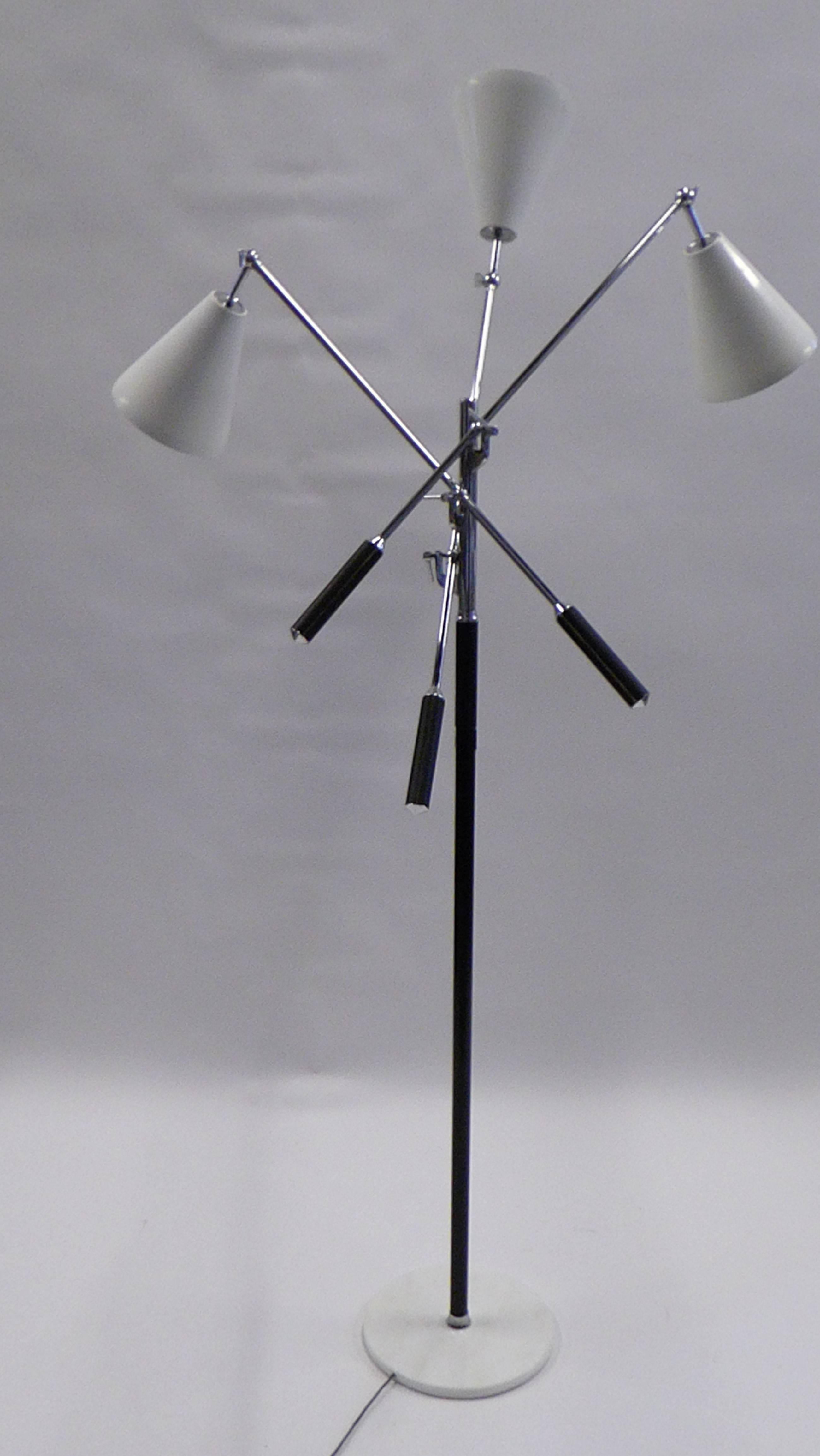 REDUCED FRO $10,000.
Designed in the style of Angelo Lelli for Arredoluce, the iconic Triennale articulating arms floor lamp. Carrara marble base, nickel chrome, three cream white shades and leather wrapped handles and pole center. Quite adjustable.