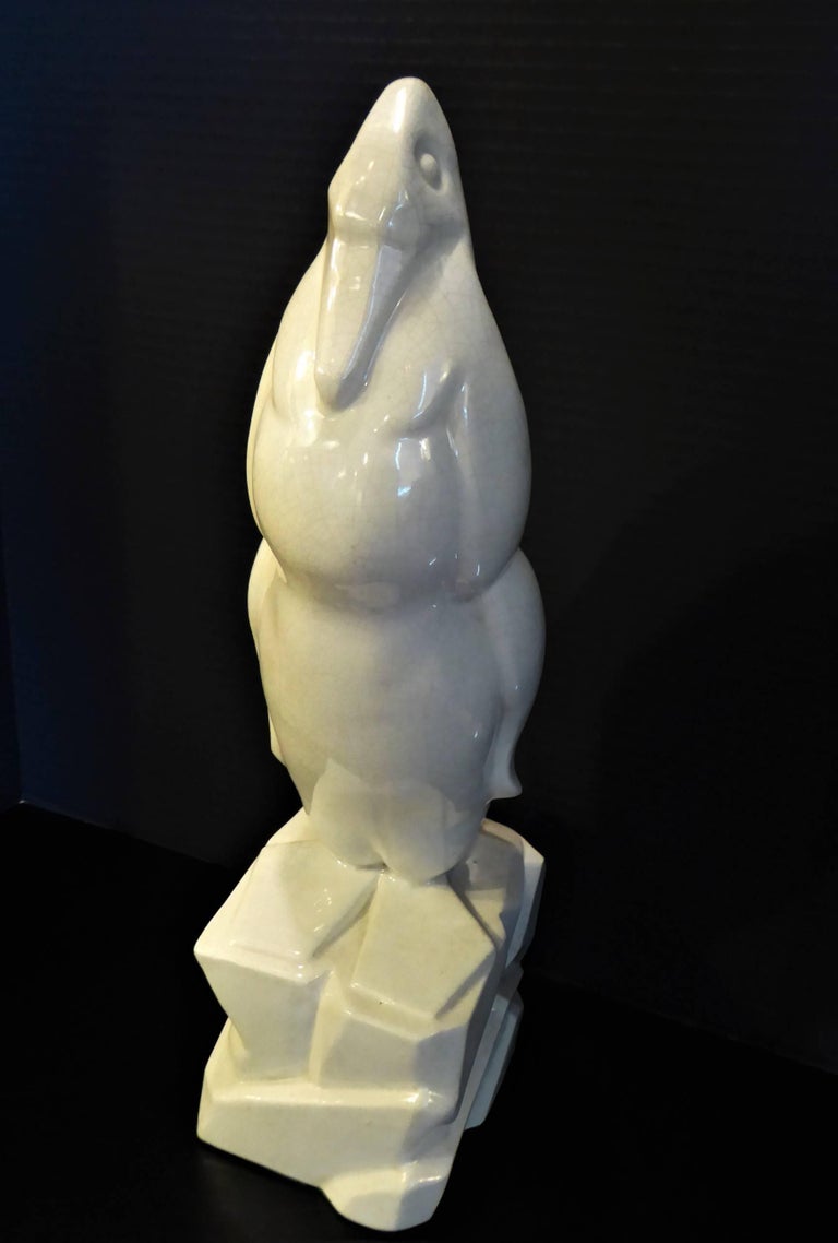 REDUCED FROM $1,650....Superb and tall Geo Conde (1891-1980) sculptural ceramic Penquin standing on an ice block. Period Art Deco, it has a crackle glaze finish and is signed impression in the side and stamped underneath Made in France. Produced at