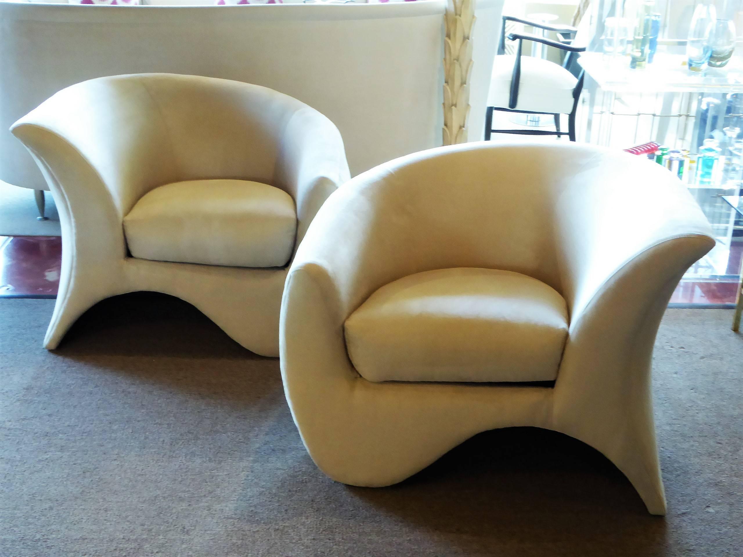 Sculptural lounge chairs by Vladimir Kagan for Directional. Very comfortable and inspired in a new nude beige ultrasuede, this pair of rarely seen Kagan chairs are a delight. Sophisticated and plush. Designed in Palm Beach, Vladimir Kagan called