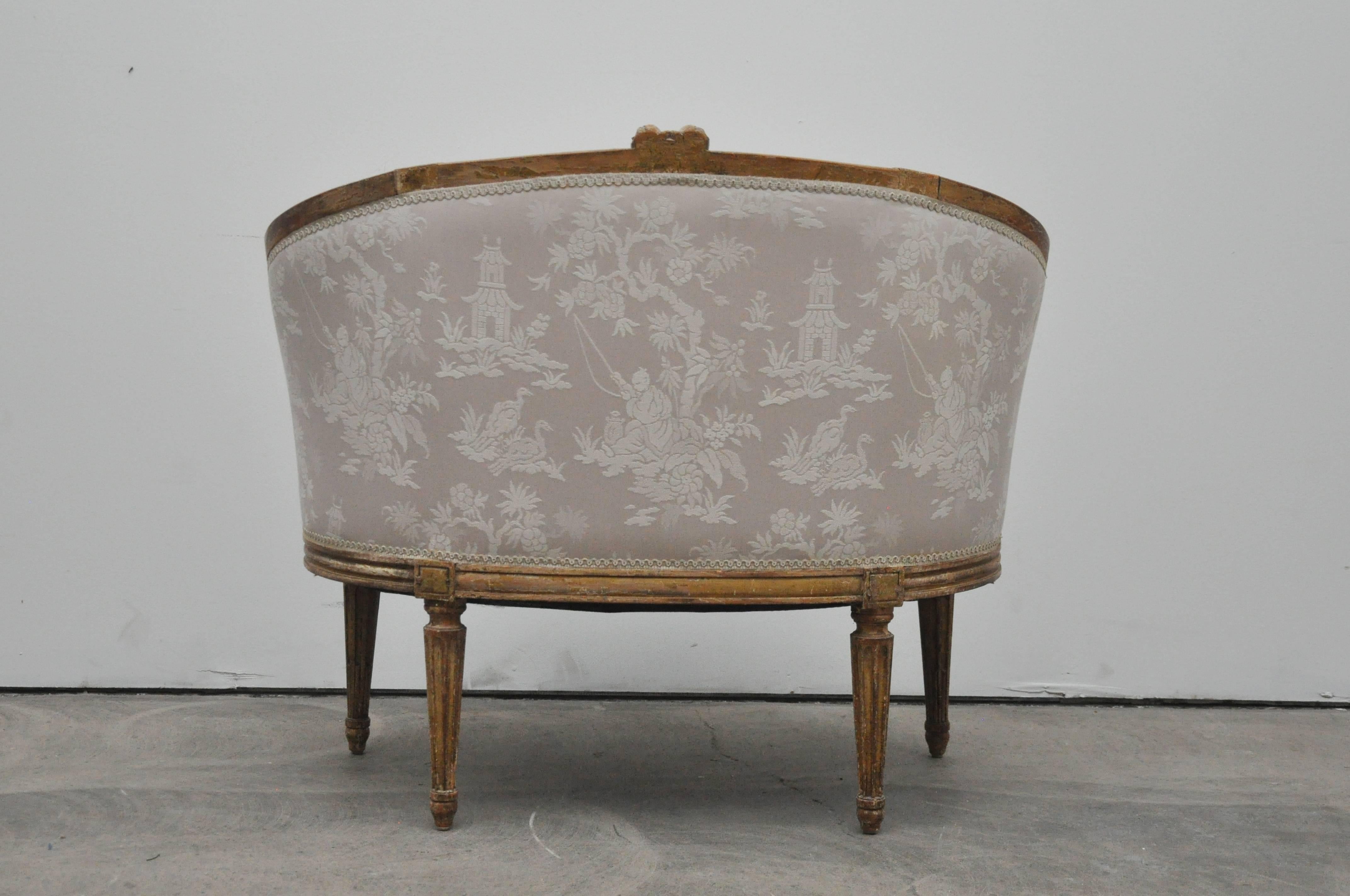 Petite French settee or canape. Nicely upholstered in chinoiserie fabric.