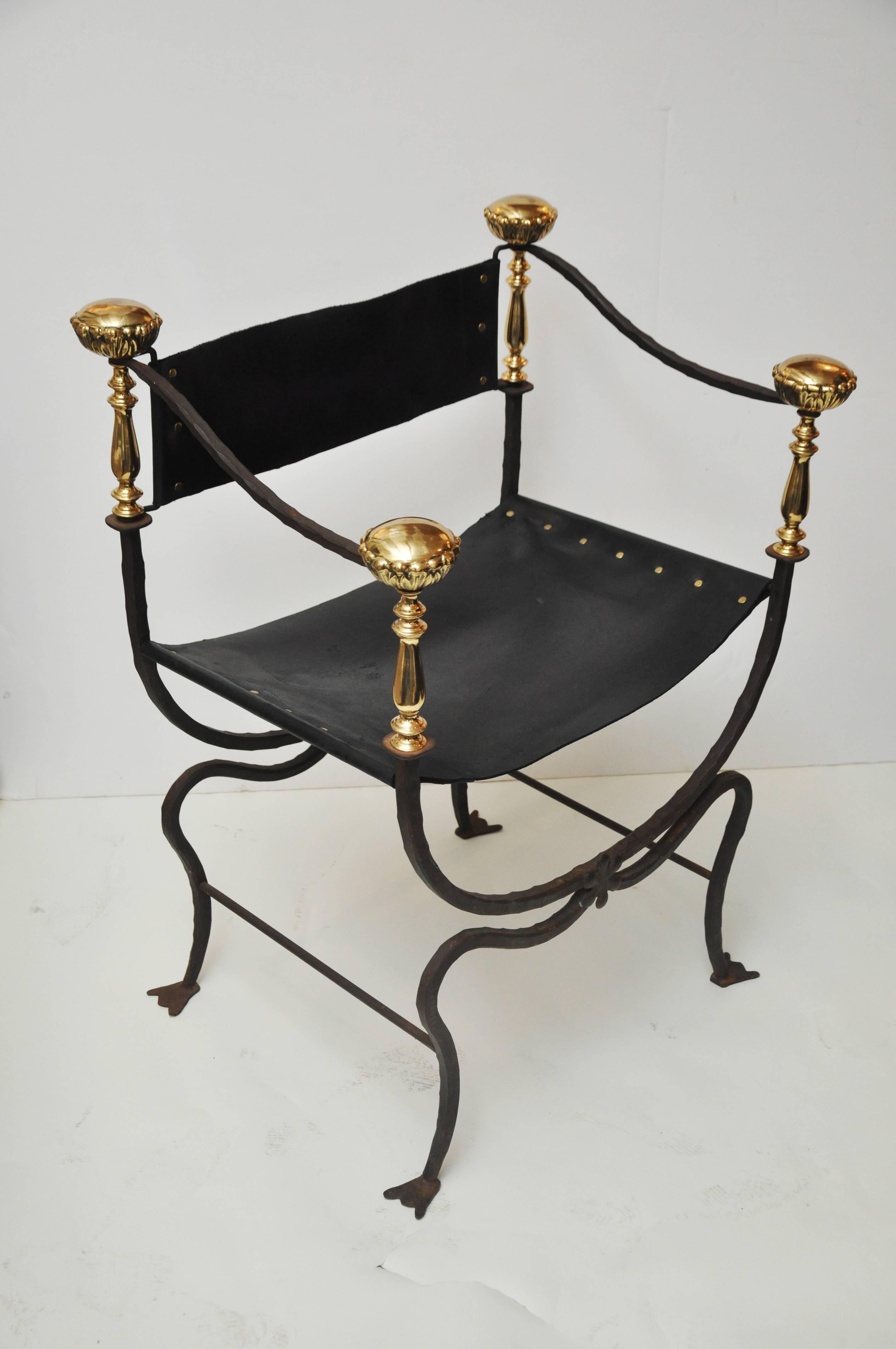 Savonarola chair with iron and brass details. Chair has beautiful curved design and unique foot design.