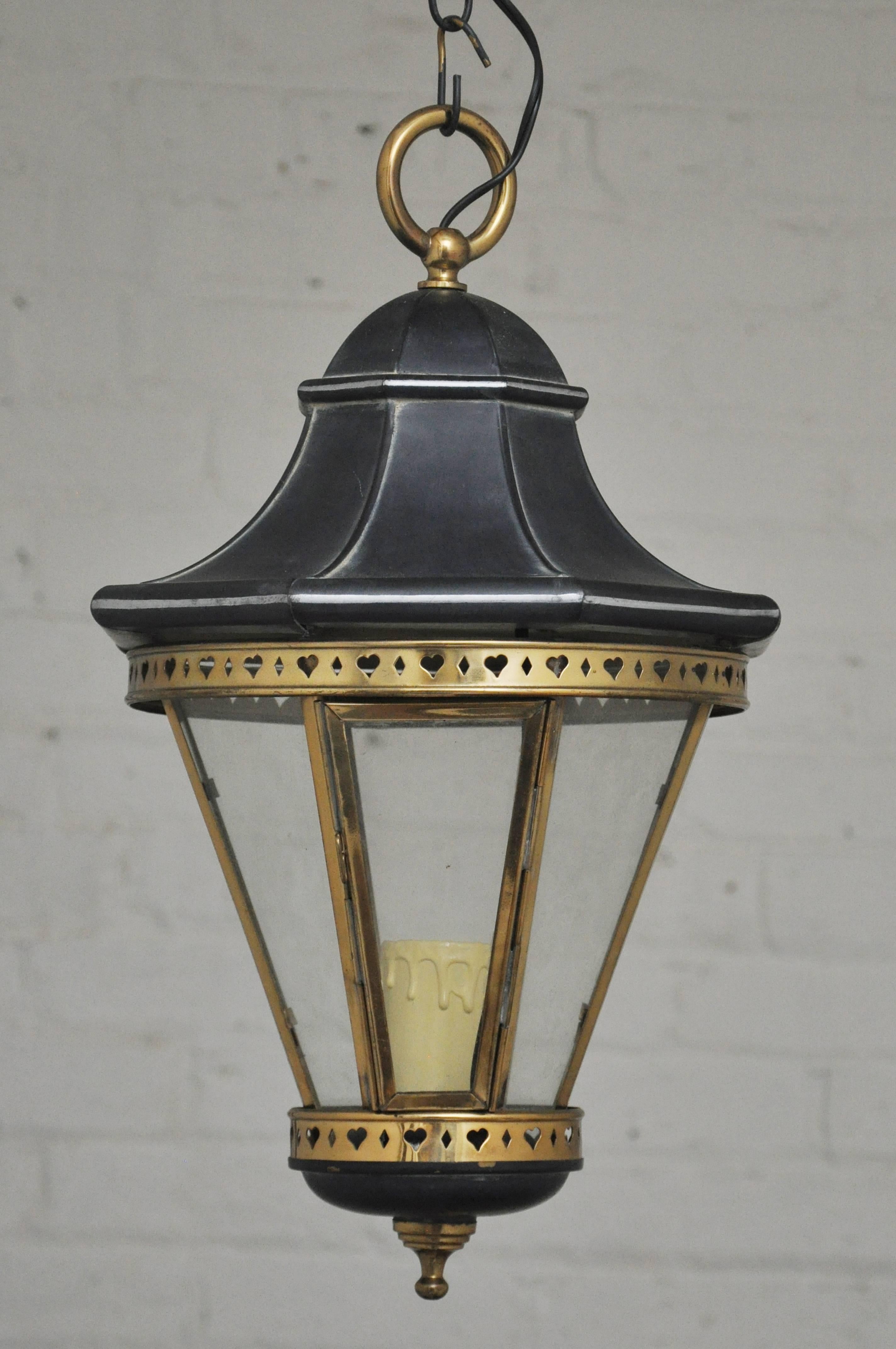 I have four available of these beautifully made lanterns. Vintage 1970s - made in Spain - but never used. Each light takes one standard size bulb up to 75 watts. Octagonal shaped with a punched out design. Re-wired and ready to install. With