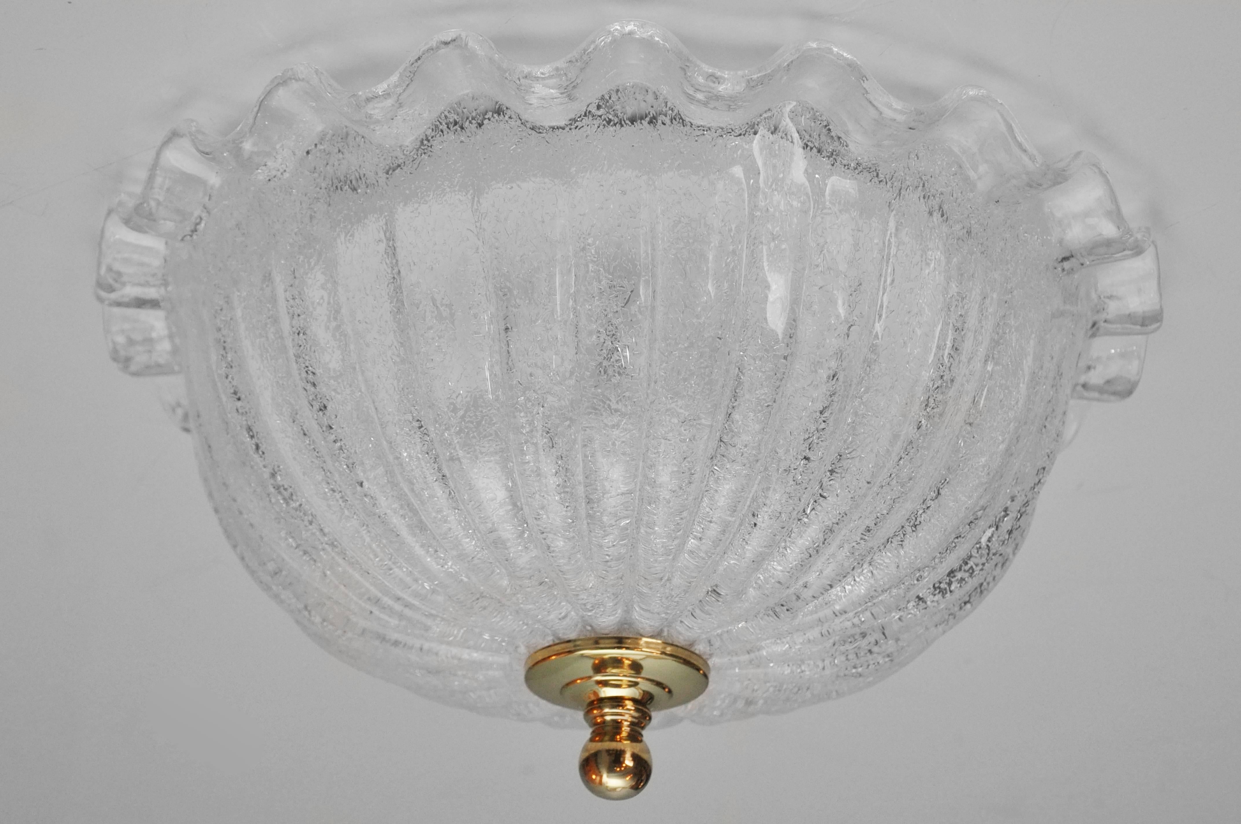 Clear Murano glass ceiling fixture. Brass finial. Underside has two standard size bulb sockets for up to 60 watts for each bulb. Attached to ceiling light fixture box. Ruffled glass edge. I have two available. Price listed is for one.