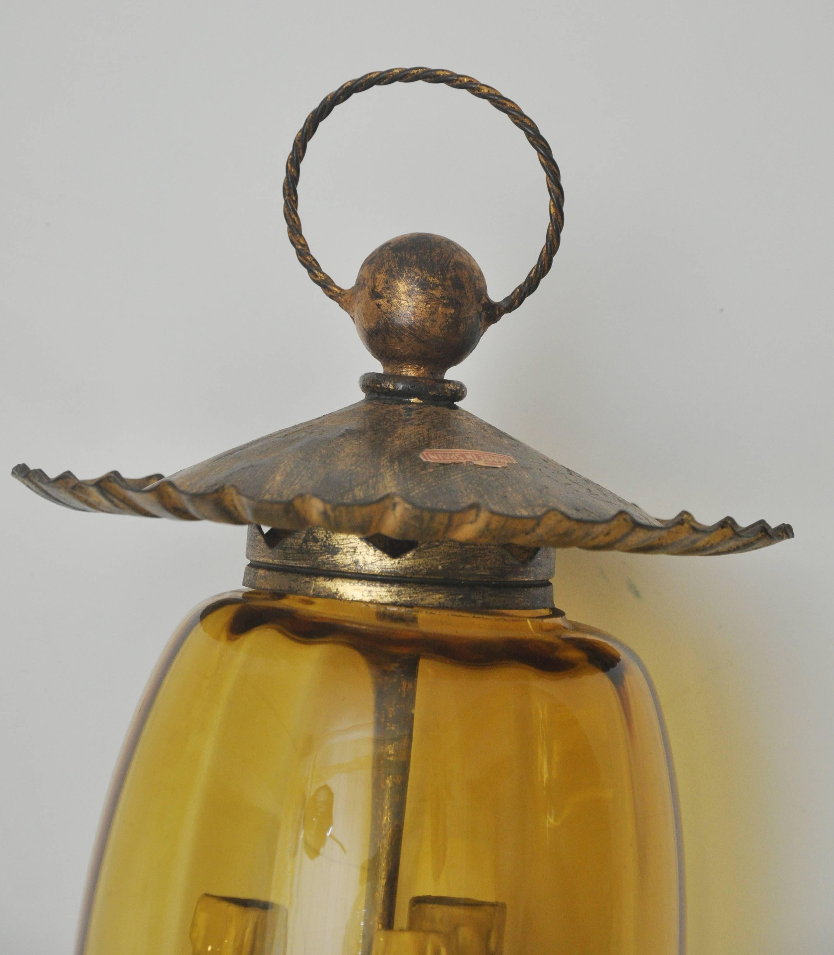 Beautifully made iron with gilt sconce. Curved amber glass. Has three standard bulb based sockets for up to 75 watts each. Great handmade details. Made in Italy in the 1960s. Re-wired and ready to install.