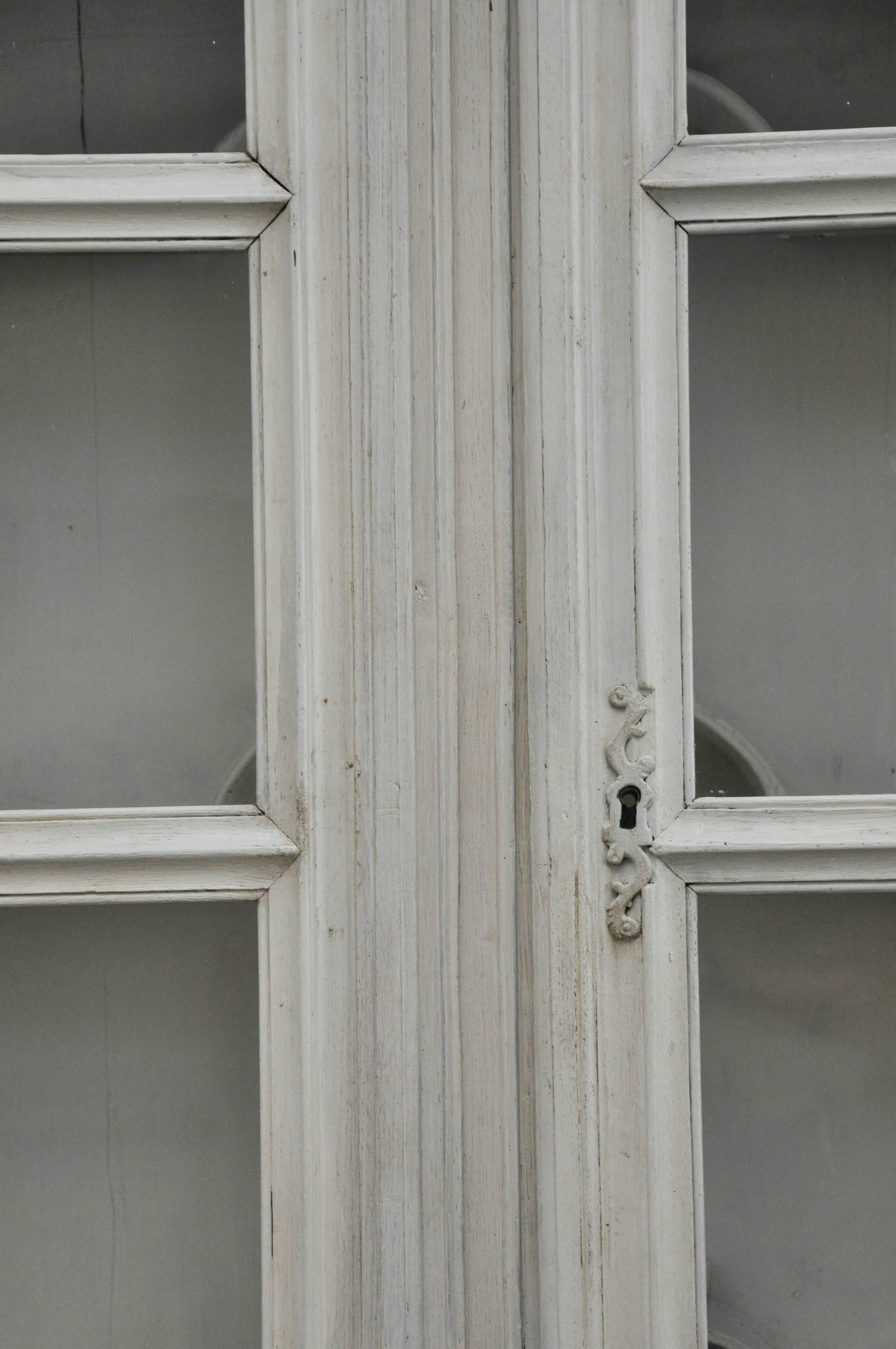 Beautiful antique painted French two-piece cupboard.