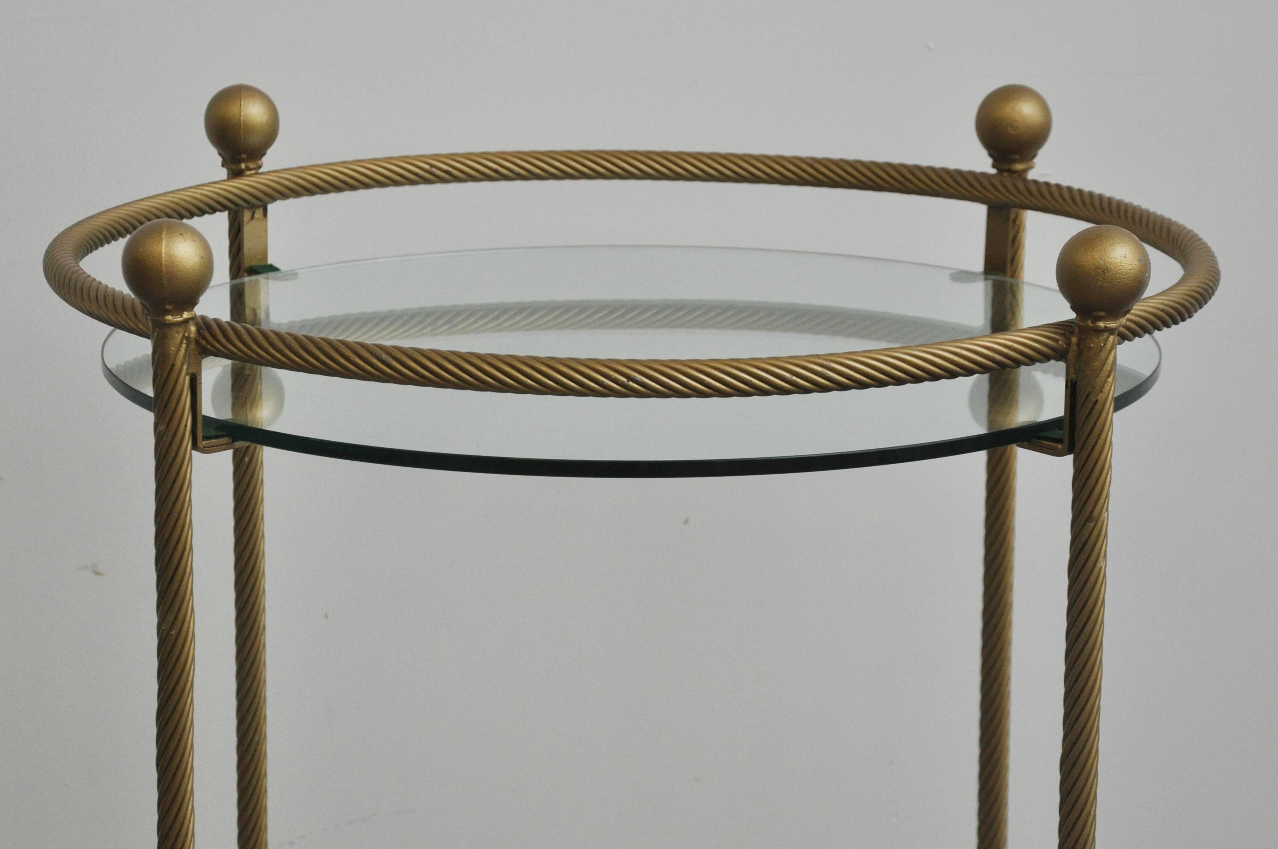 Brass rope design two glass shelves on wheels. Vintage, 1950s bar cart of occasional table.
