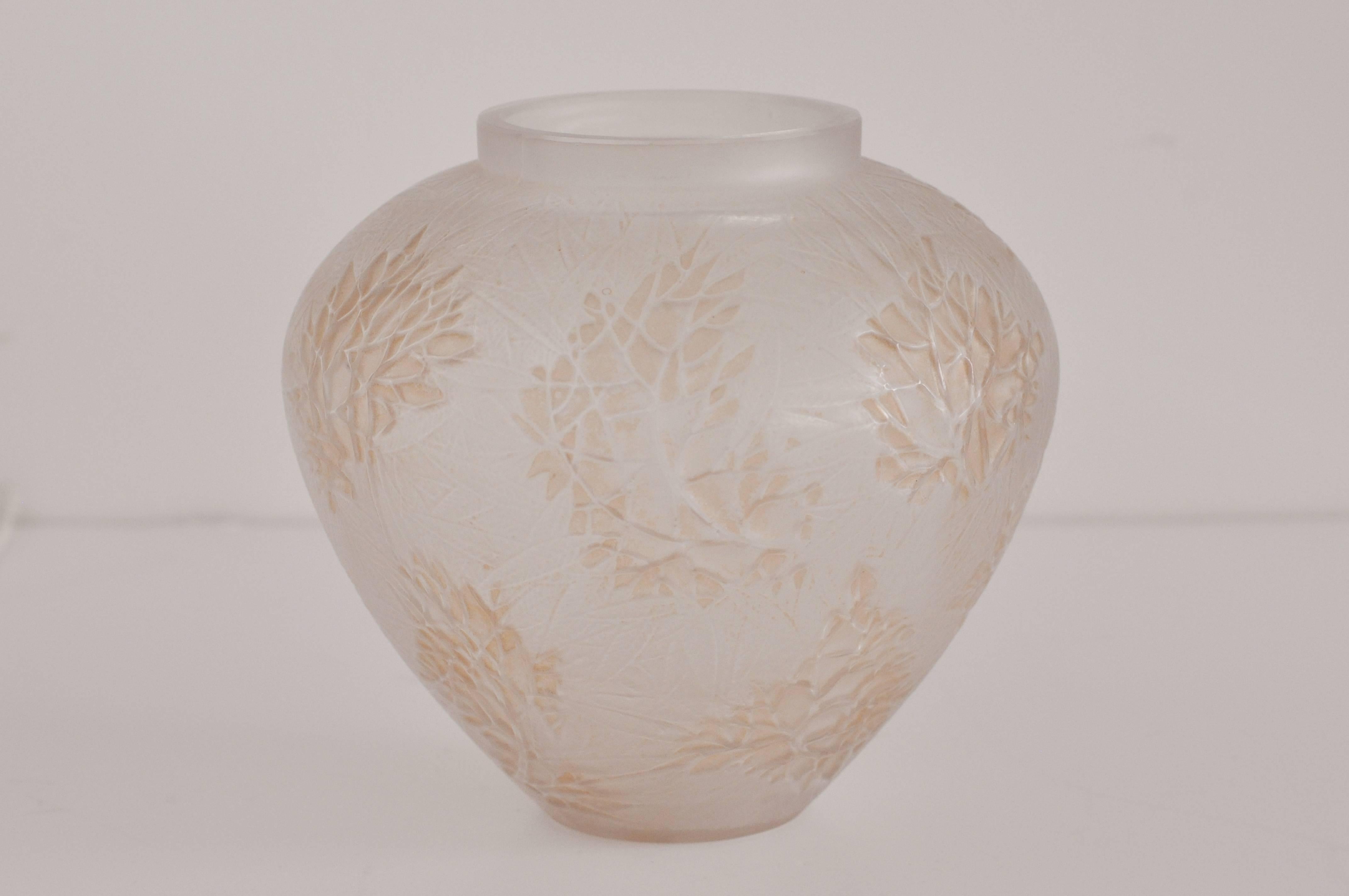R. Lalique "Esterel" vase, bulbous shape in frosted glass with a stylized floral and leaf pattern.