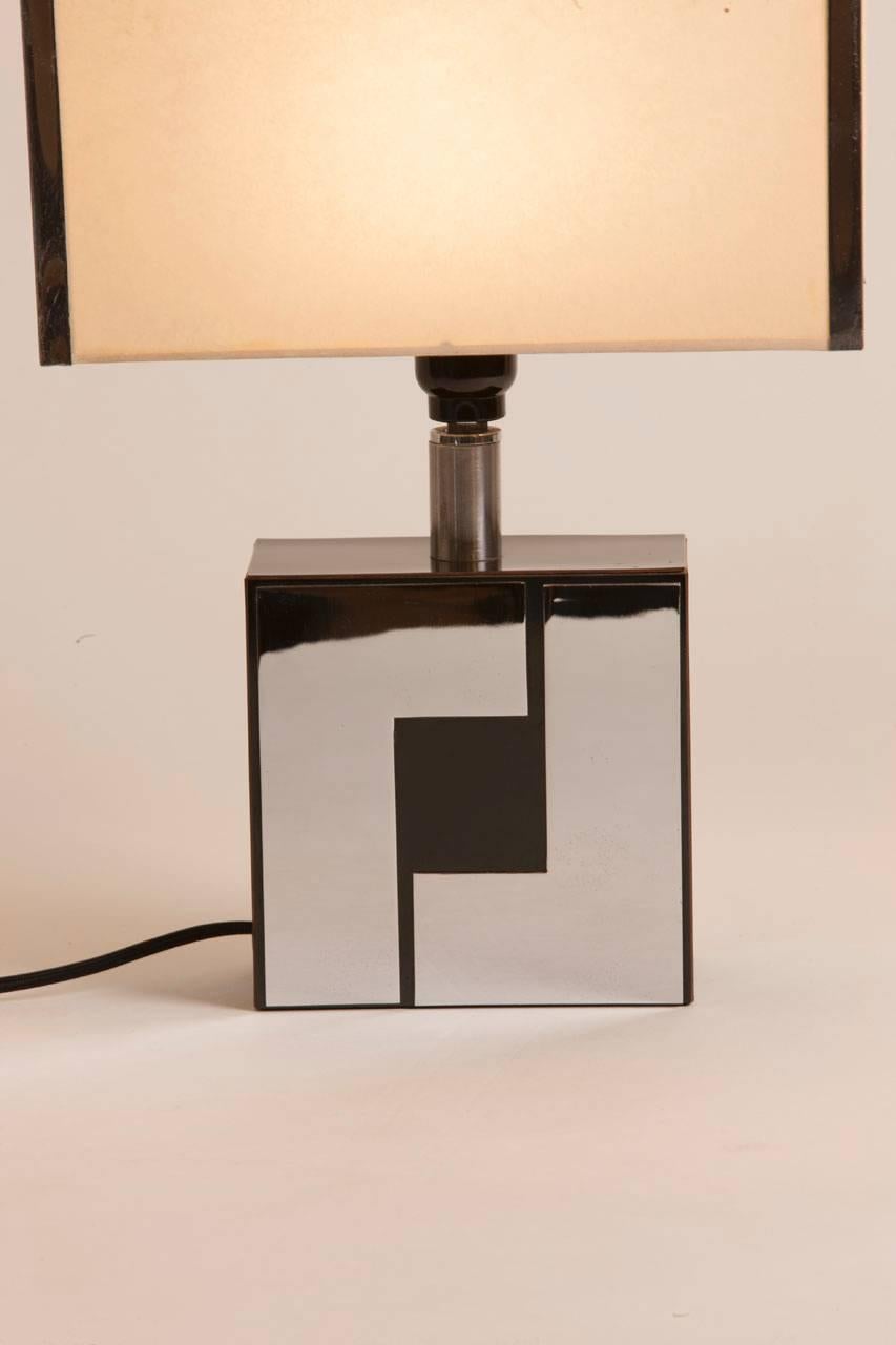 Philippe Jean style chrome and black lacquer table lamp with original shade featuring chrome detail.