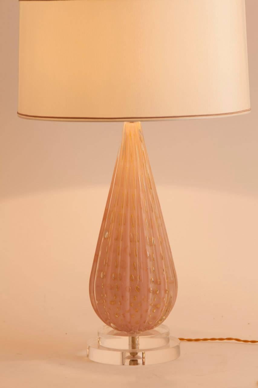 Vintage Mid-Century Murano table lamp featuring dusty pink glass with gold bubble inclusion. This lamp sits on a custom Lucite base and has been completely rewired. The custom silk shade was made in Paris.