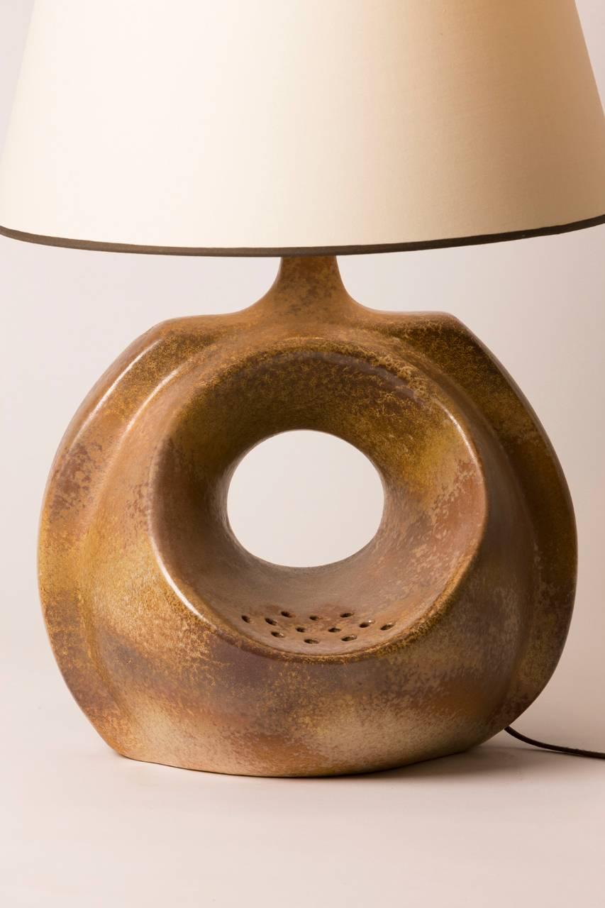 Midcentury French ceramic table lamp created in Vallauris. Lamp features custom shade made in Paris and has been rewired for the United States.