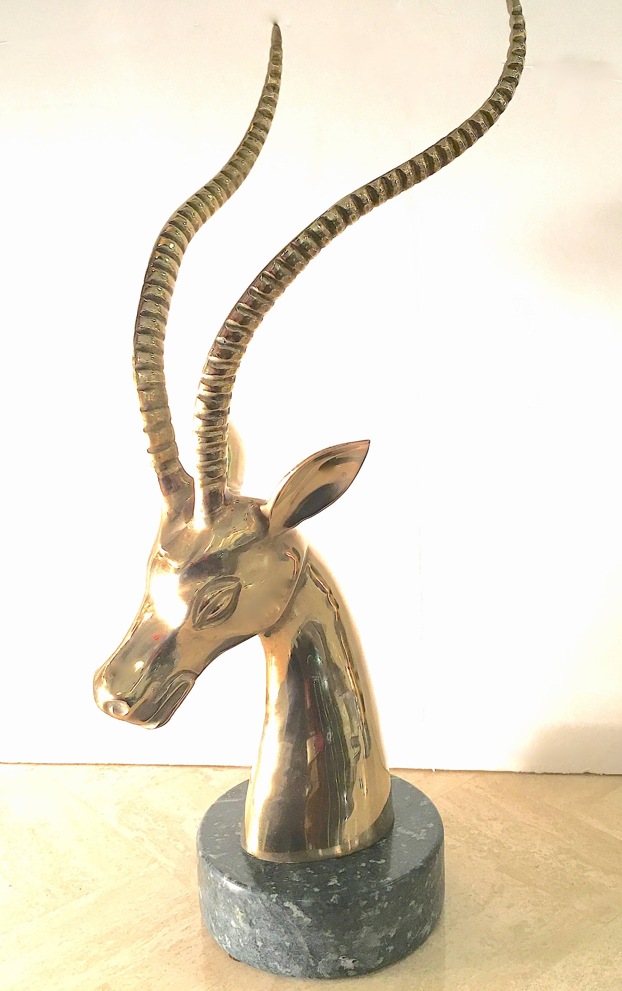 Pair of large-scale brass gazelles or ibexes mounted on green marble bases. Impressive! Please contact for location. 