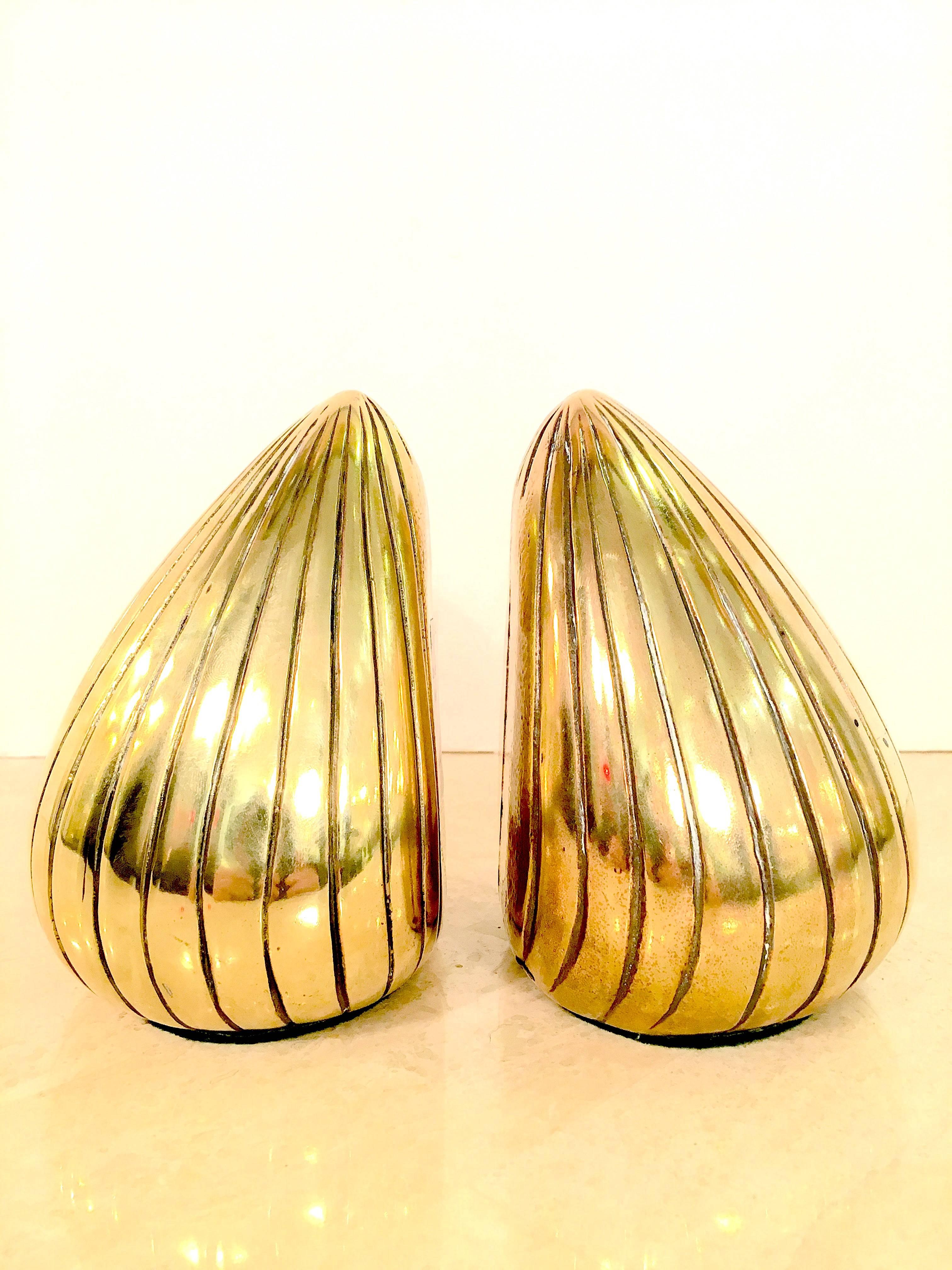 Iconic pair of sculptural brass bookends by Ben Seibel for Jenfred-Ware. Nicely polished to a bright shine. Please contact for location.