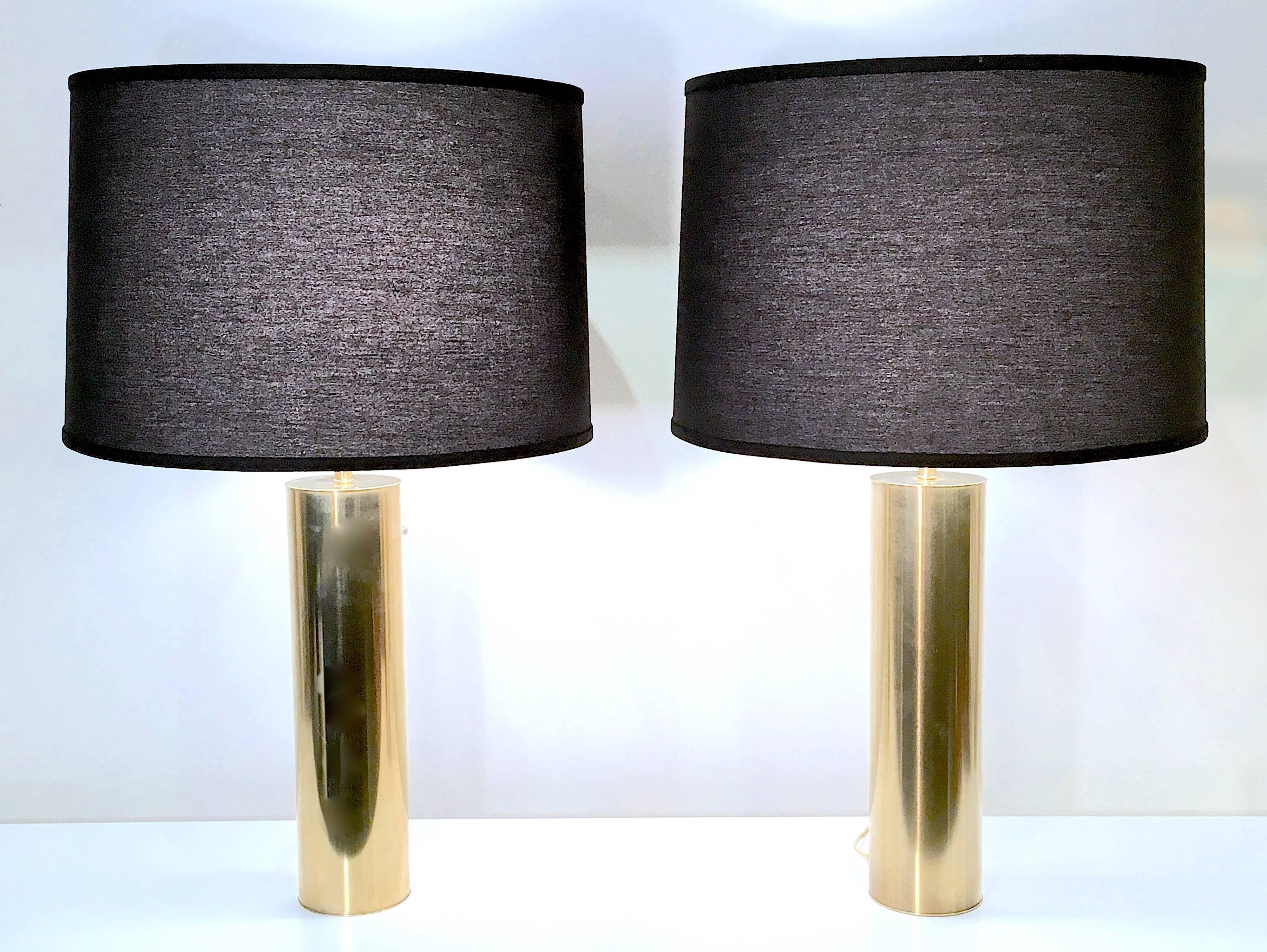 Handsome pair of Nessen lamps finished in a brushed brass. 