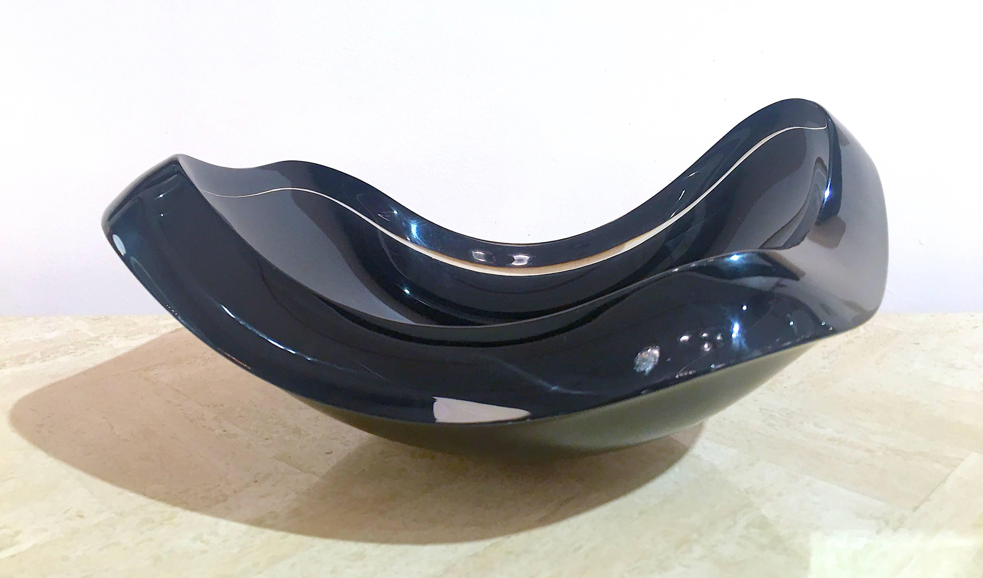 Very rare black Lucite bowl by Ritts co. The bowl is sculpted from very thick translucent smoked Lucite with a black finish on the bottom. Stunning. Please contact for location.  